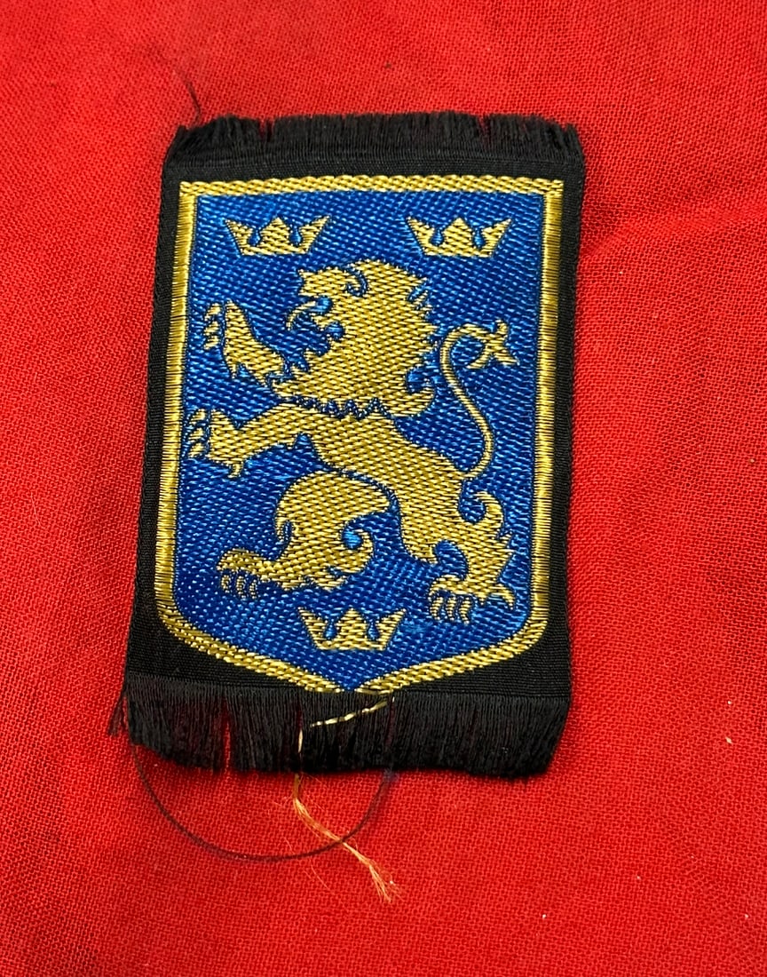 WW2 GERMAN 14TH WAFFEN GRENADIER DIVISION (1ST GALICIEN) SLEEVE INSIGNIA: WW2 GERMAN 14TH WAFFEN GRENADIER DIVISION (1ST GALICIEN) SLEEVE INSIGNIA. Rare 14th Waffen-Grenadier Division 'Galizien' of the Waffen-SS (Ukrainian Nr.1) uniform-removed sleeve insignia, a yellow ram