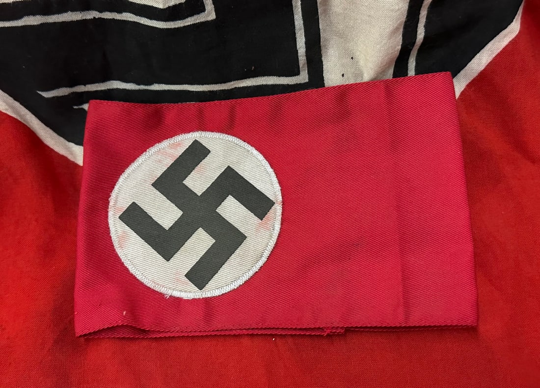SCARCE WW2 GERMAN NSDAP TUNIC ARMBAND WITH RZM PAPER TAG: SCARCE WW2 GERMAN NSDAP TUNIC ARMBAND WITH RZM PAPER TAG. A VERY RARE EXAMPLE. SHOWS GOOD WEAR AND USE WITH A BEAUTIFUL OVERALL PATINA. PLEASE VIEW ALL DETAILED PICTURES. A VERY RARE EXAMPLE.