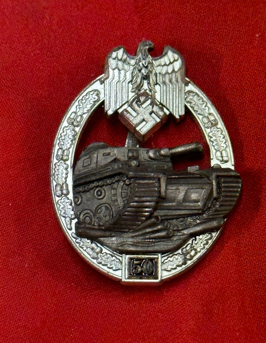 WW2 GERMAN PANZER ASSAULT BADGE IN SILVER 50 ASSAULTS BY JOSEF FEIX: WW2 GERMAN PANZER ASSAULT BADGE IN SILVER 50 ASSAULTS BY JOSEF FEIX. Panzer assault badge in silver 50 assaults by Josef Feix, Gablonz. Zink constructed wreath with riveted zink eagle. Maker marked wi