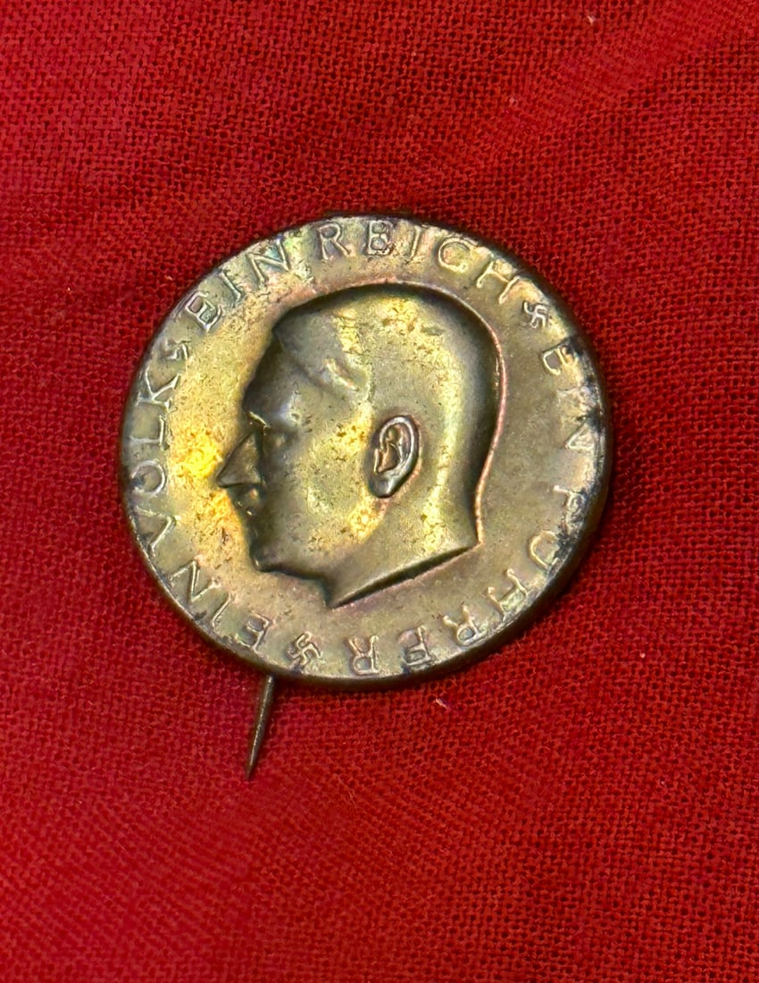 WW2 German NSDAP Election Slogan Lapel Pin - Hitler's Head: WW2 German NSDAP Election Slogan Lapel Pin - Hitler's Head. Stainless steel, gold brennlack obverse finish, non-magnetic, 28 mm, steel pin secured by a bent over tab, one of the best metal varieties m