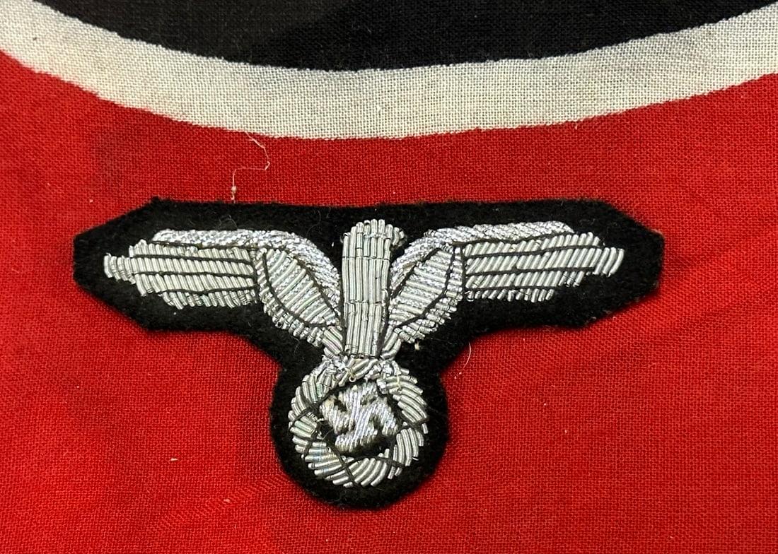 GERMAN WWII ARMY OFFICER BULLION TUNIC EAGLE: GERMAN WWII ARMY OFFICER BULLION TUNIC EAGLE. Silver wire embroidery on dark green wool badge cloth. Removed from uniform. Shows good wear and use with a beautiful overall patina. Please view all deta