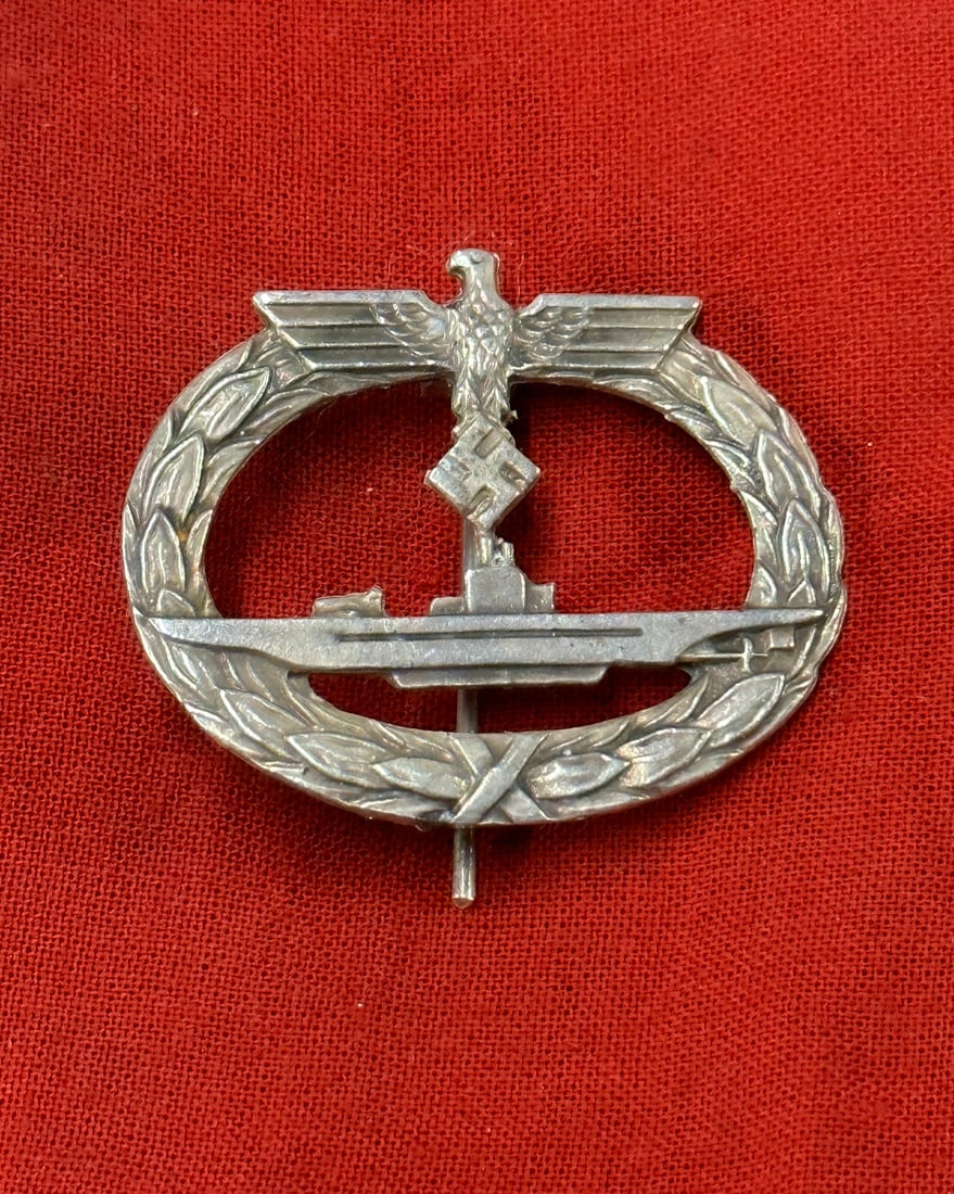 WW2 GERMAN KRIEGSMARINE U-BOAT BADGE BY OTTO SCHICKLE: WW2 GERMAN KRIEGSMARINE U-BOAT BADGE BY OTTO SCHICKLE. Kriegsmarine U-boat badge by Otto Schickle, Pforzheim. Zink construction with soldered on set up. Unmarked, later war example.