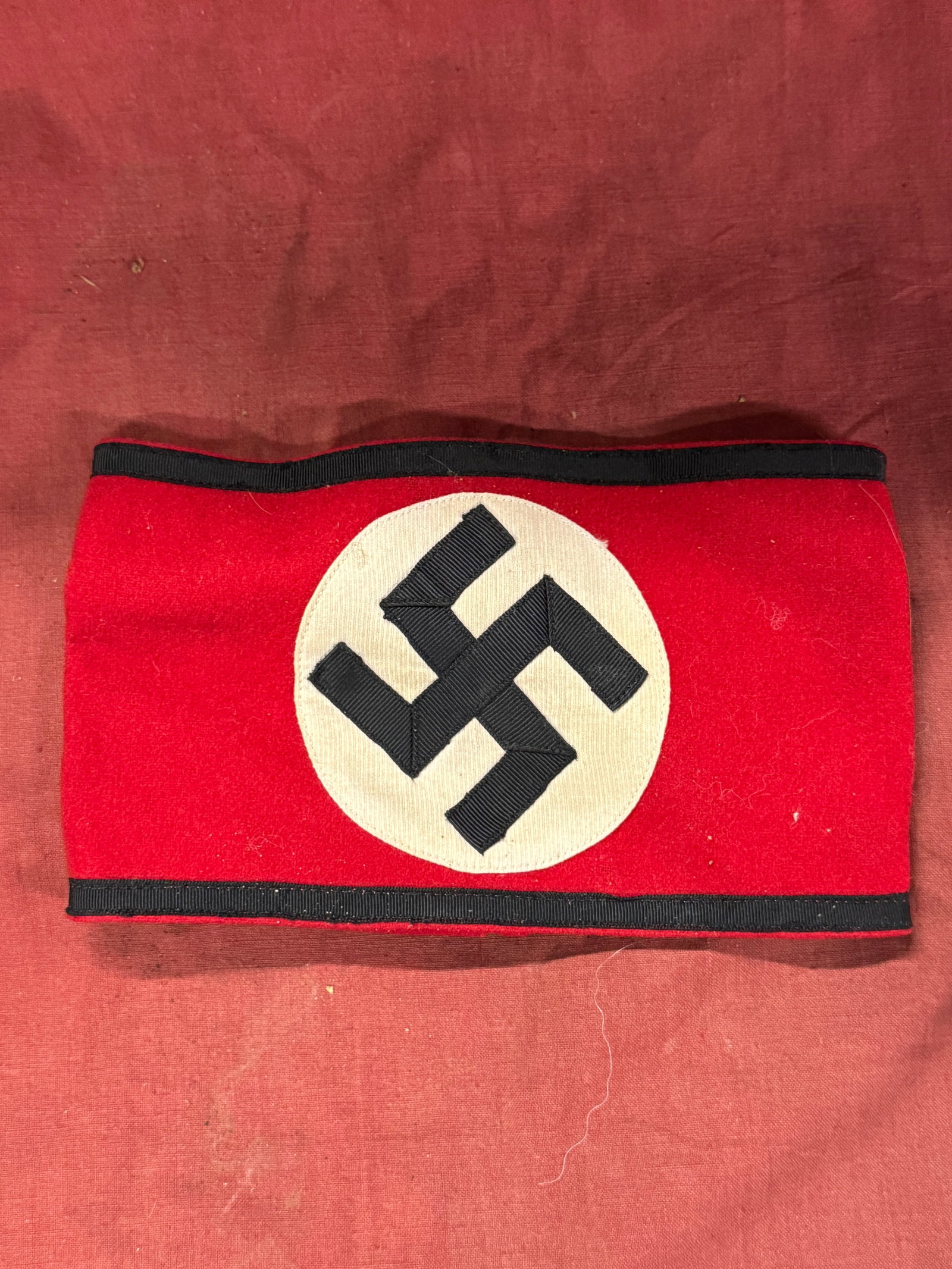 German WWII SS Member's Multi-Piece Cotton Armband - Schutzstaffel With RZM Paper Tag: German WWII SS Member's Multi-Piece Cotton Armband - Schutzstaffel. The SS (Schutzstaffel - 'Protection Squadron') was originally formed in 1925, ostensibly to act as a small, loyal bodyguard unit to 