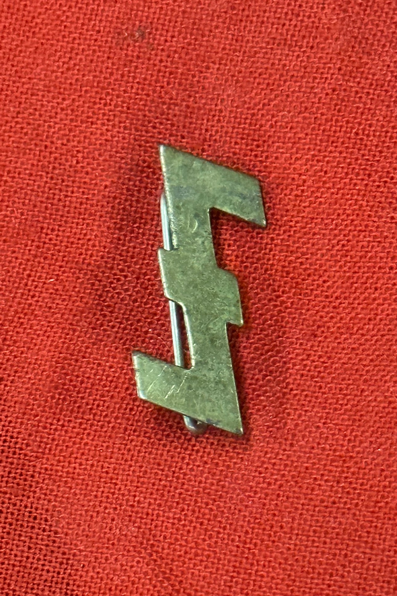 WW2 German NSB Dutch Wolfsangel Pin Badge: WW2 German NSB Dutch Wolfsangel Pin Badge. A rare example. Shows good wear and use with a beautiful overall patina. A rare example.