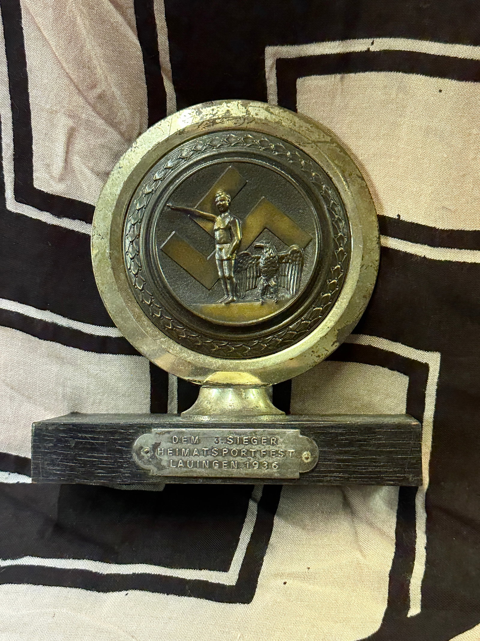 RARE WW2 GERMAN SPORTS FESTIVAL DESK ORNAMENT: RARE WW2 GERMAN SPORTS FESTIVAL DESK ORNAMENT. DEPICTING A HITLER YOUTH MEMBER WITH EAGLE SALUTING. SHOWS GOOD WEAR AND USE WITH A BEAUTIFUL OVERALL PATINA. PLEASE VIEW ALL DETAILED PICTURES. A SCARCE