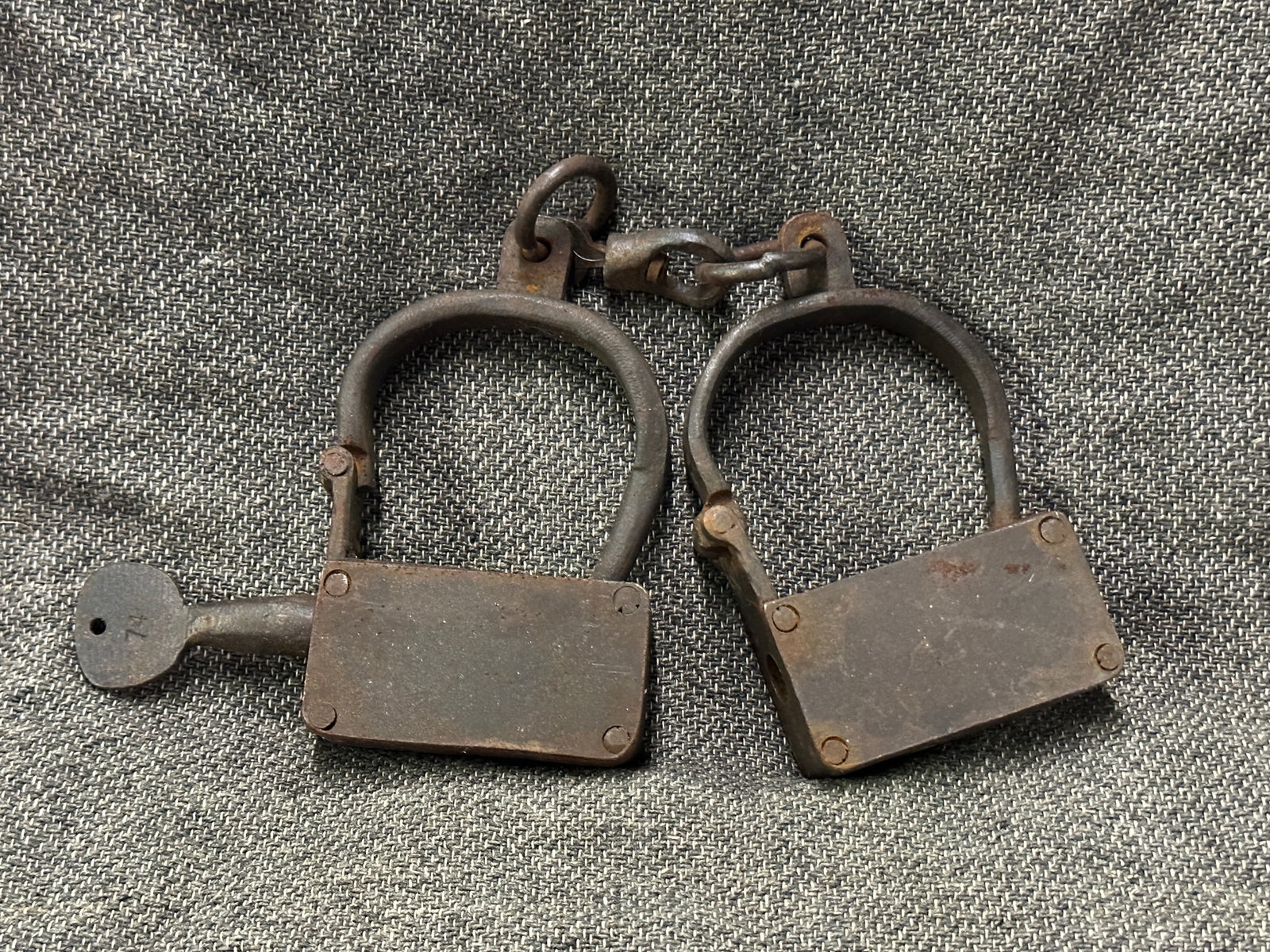 RARE CIVIL WAR ERA SLAVE SHACKLES - PROPERTY OF PLANTATION POLICE: RARE CIVIL WAR ERA SLAVE SHACKLES - PROPERTY OF PLANTATION POLICE. A VERY SCARCE FIND. SHOWS GOOD WEAR AND USE WITH A BEUATIFUL OVERALL PATINA. PLEASE VIEW ALL DETAILED PICTURES. A SCARCE EXAMPLE.