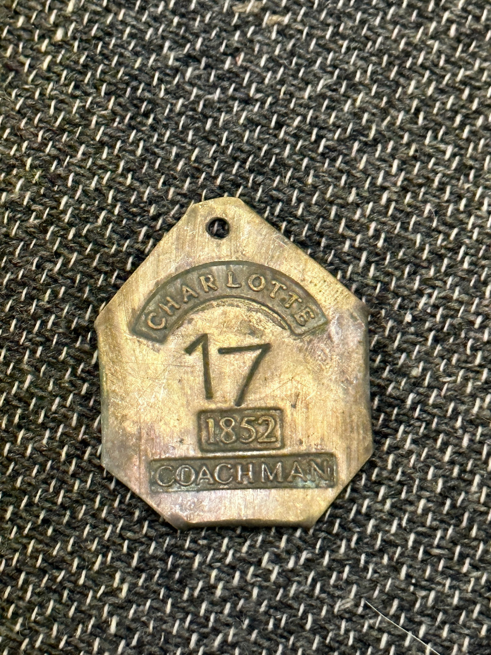 DATED 1852 CHARLOTTE COACHMAN #17 SLAVE TAG SERVANT ID: DATED 1852 CHARLOTTE COACHMAN #17 SLAVE TAG SERVANT ID. A VERY RARE FIND. SHOWS GOOD WEAR AND USE WITH A BEAUTIFUL OVERALL PATINA. A VERY RARE FIND.