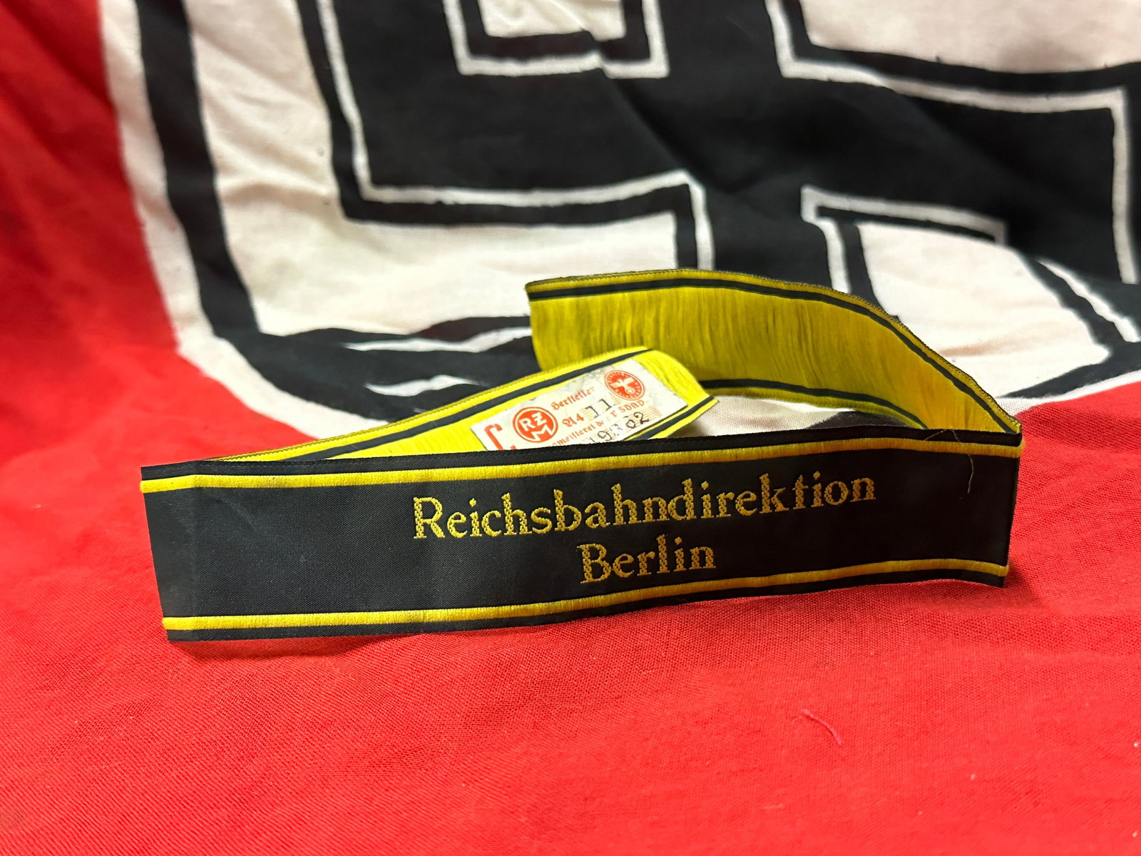 WW2 GERMAN REICHSBAHN ARMY CUFF TITLE WITH RZM MAKER MARK: WW2 GERMAN REICHSBAHN ARMY CUFF TITLE WITH RZM MAKER MARK. A RARE FIND. SHOWS GOOD WEAR AND USE WITH A BEAUTIFUL OVERALL PATINA. PLEASE VIEW ALL DETAILED PICTURES. A WELL MADE ANTIQUE GERMAN ARTIFACT.