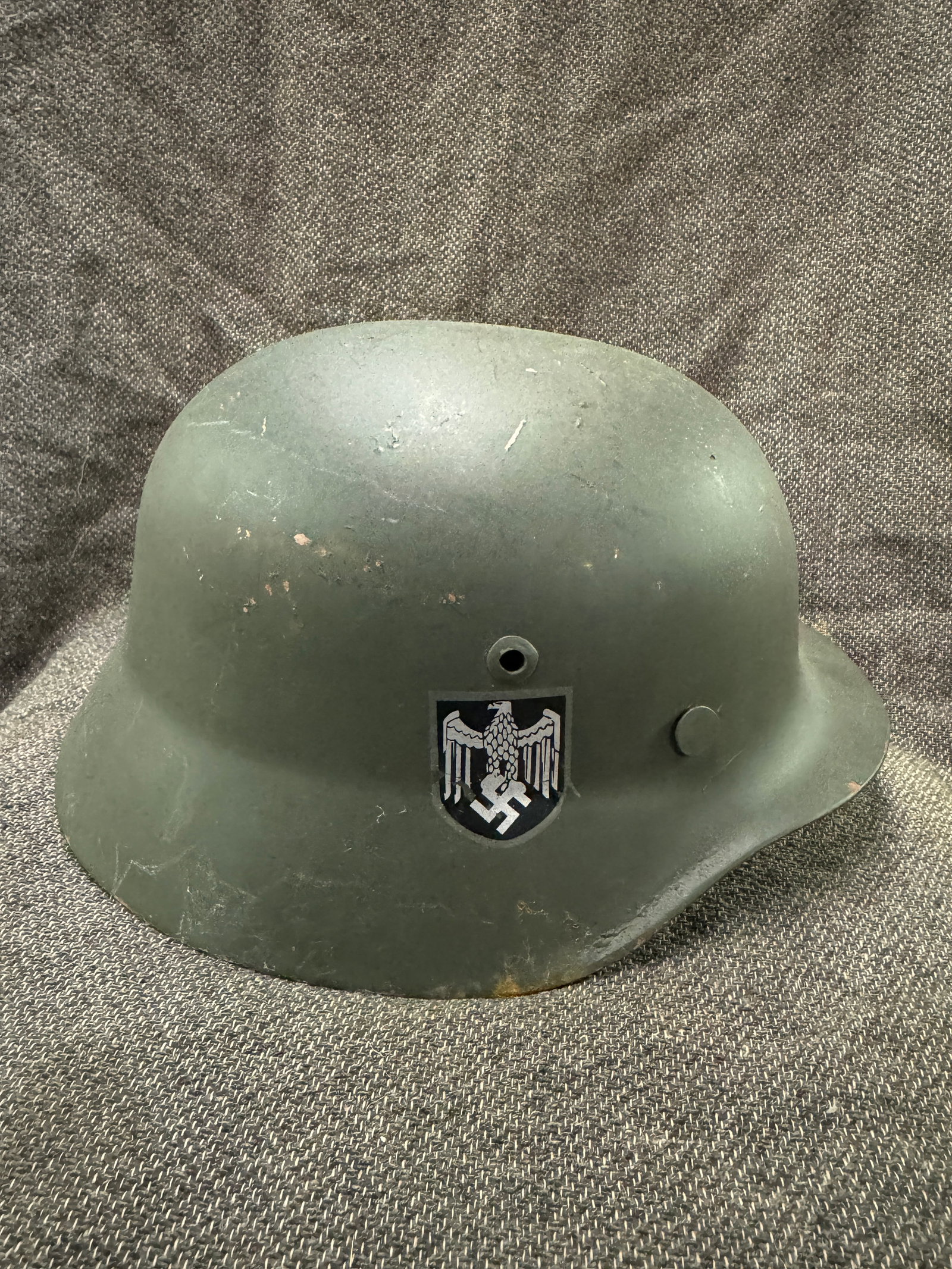 WWII GERMAN REICH DOUBLE DECAL M40 STAHLHELM: WWII GERMAN REICH DOUBLE DECAL M40 STAHLHELM. Helmet features two decals, right side is the Wehrmacht eagle insignia, left side is a German Flag decal. Interior of the helmet features a leather liner.