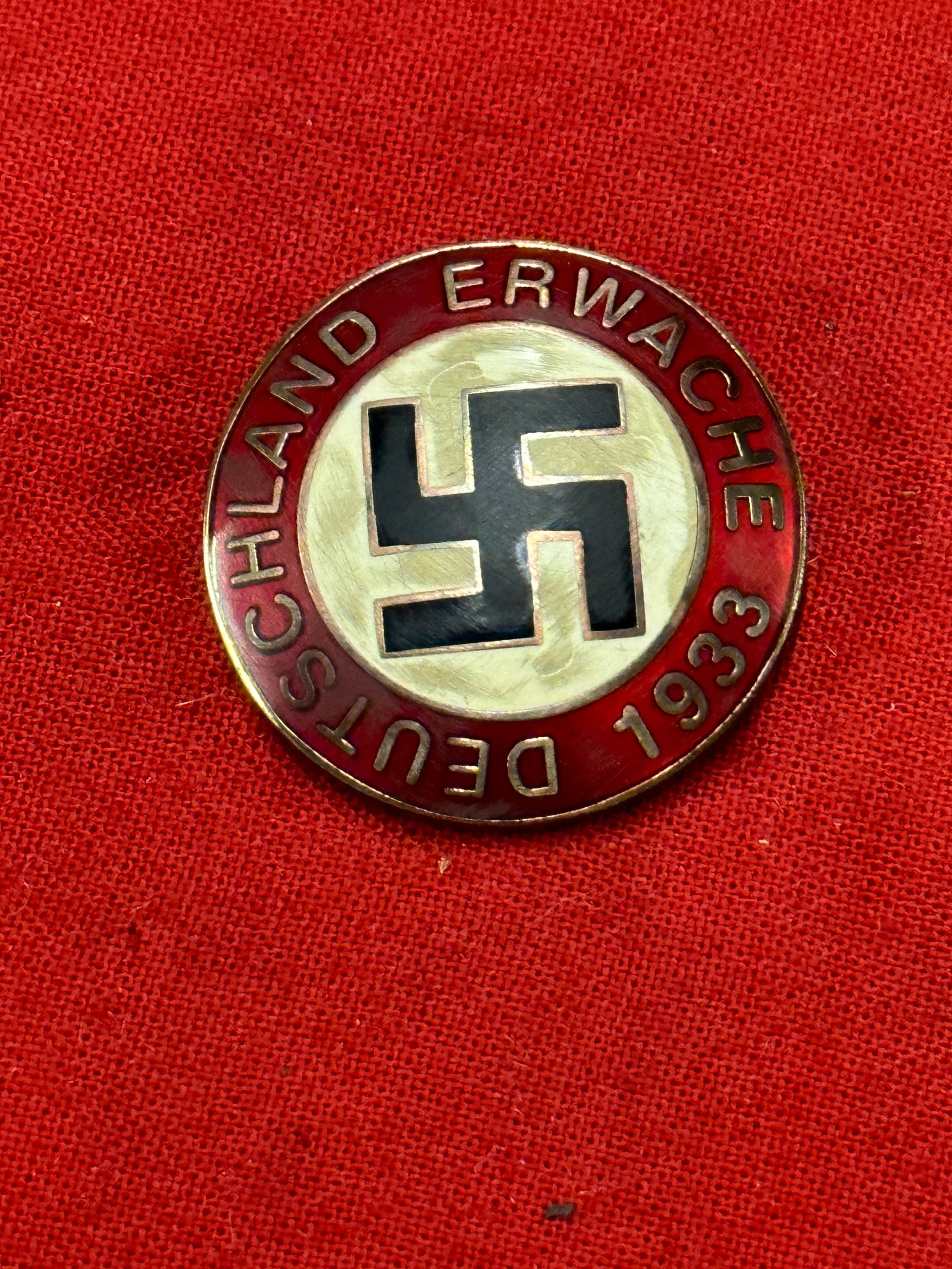 WW2 GERMAN DEUTSCHLAND ERWACHE LAPEL ENAMELED PIN BADGE: WW2 GERMAN DEUTSCHLAND ERWACHE LAPEL ENAMELED PIN BADGE. SHOWS GOOD WEAR AND USE WITH A BEAUTIFUL OVERALL PATINA. ENAMEL STILL INTACT. PLEASE VIEW ALL DETAILED PICTURES. A VERY RARE EXAMPLE.