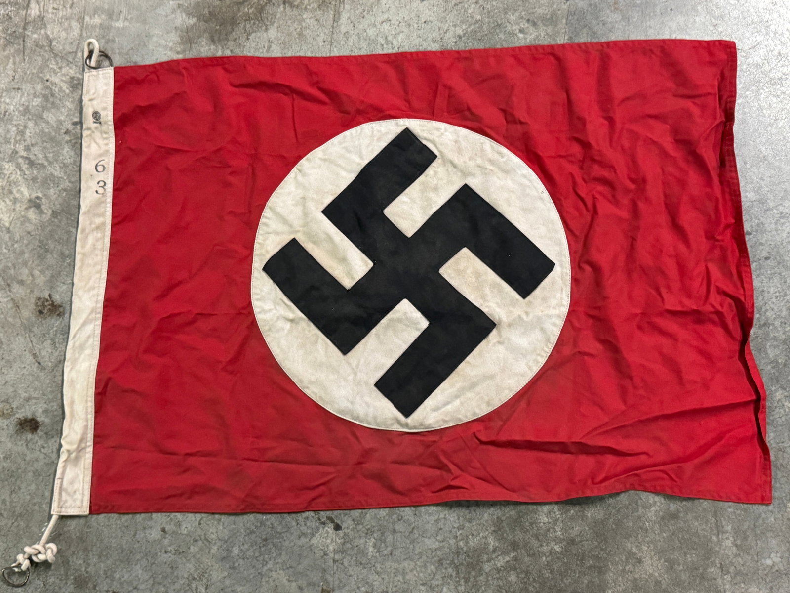 SCARCE WW2 GERMAN NSDAP POLITICAL FLAG BY RZM: SCARCE WW2 GERMAN NSDAP POLITICAL FLAG BY RZM. A VERY RARE EXAMPLE THAT IS IN MINT OVERALL SHAPE AND CONDITION WITH A BEAUTIFUL OVERALL PATINA. SHOWS GOOD WEAR AND USE. A SCARCE EXAMPLE.