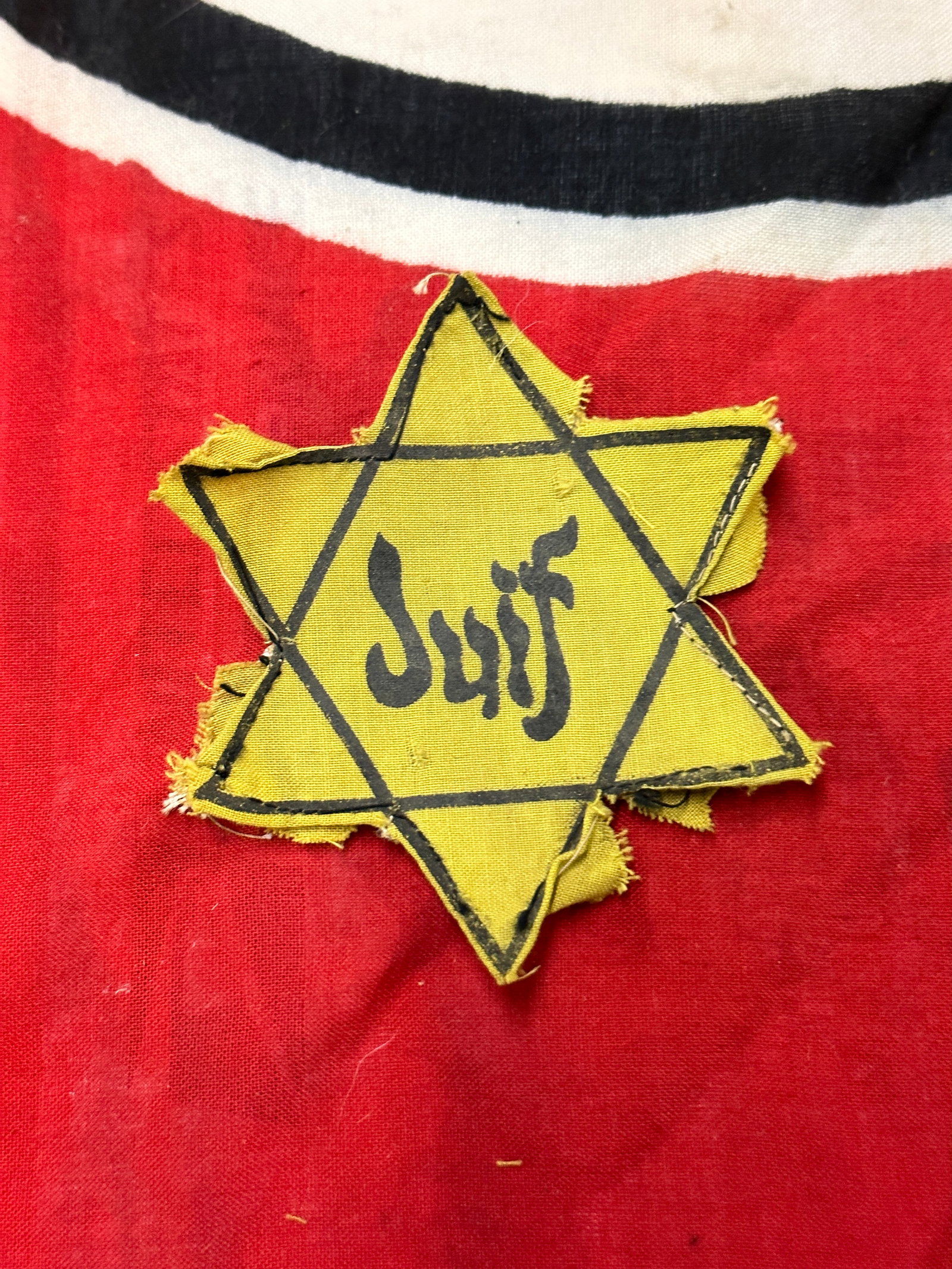 SCARCE ORIGINAL WW2 GERMAN FRENCH ‘JUIF’ STAR OF DAVID: SCARCE ORIGINAL WW2 GERMAN FRENCH JUIF STAR OF DAVID. A VERY RARE EXAMPLE. SHOWS GOOD WEAR AND USE WITH A BEAUTIFUL OVERALL PATINA. PLEASE VIEW ALL DETAILED PICTURES. A SCARCE FIND.