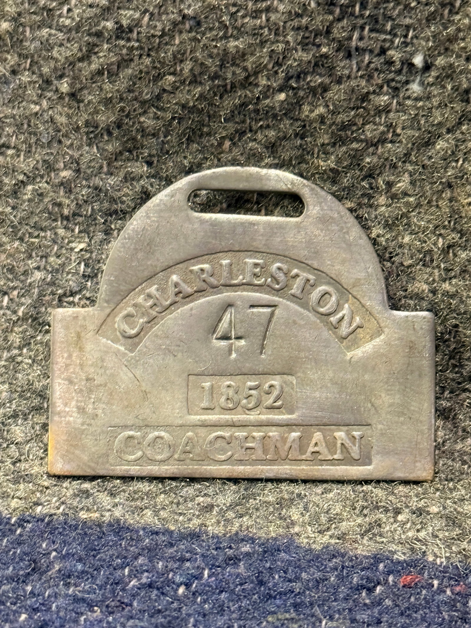 DATED 1852 CHARLESTON #47 COACHMAN SLAVE TAG SERVANT ID: DATED 1852 CHARLESTON #47 COACHMAN SLAVE TAG SERVANT ID. A RARE FIND. SHOWS GOOD WEAR AND USE WITH A BEAUTIFUL OVERALL PATINA. HAS A GREAT LOOK TO IT WITH AN EXCELLENT OVERALL EYE APPEAL. PLEASE VIEW 