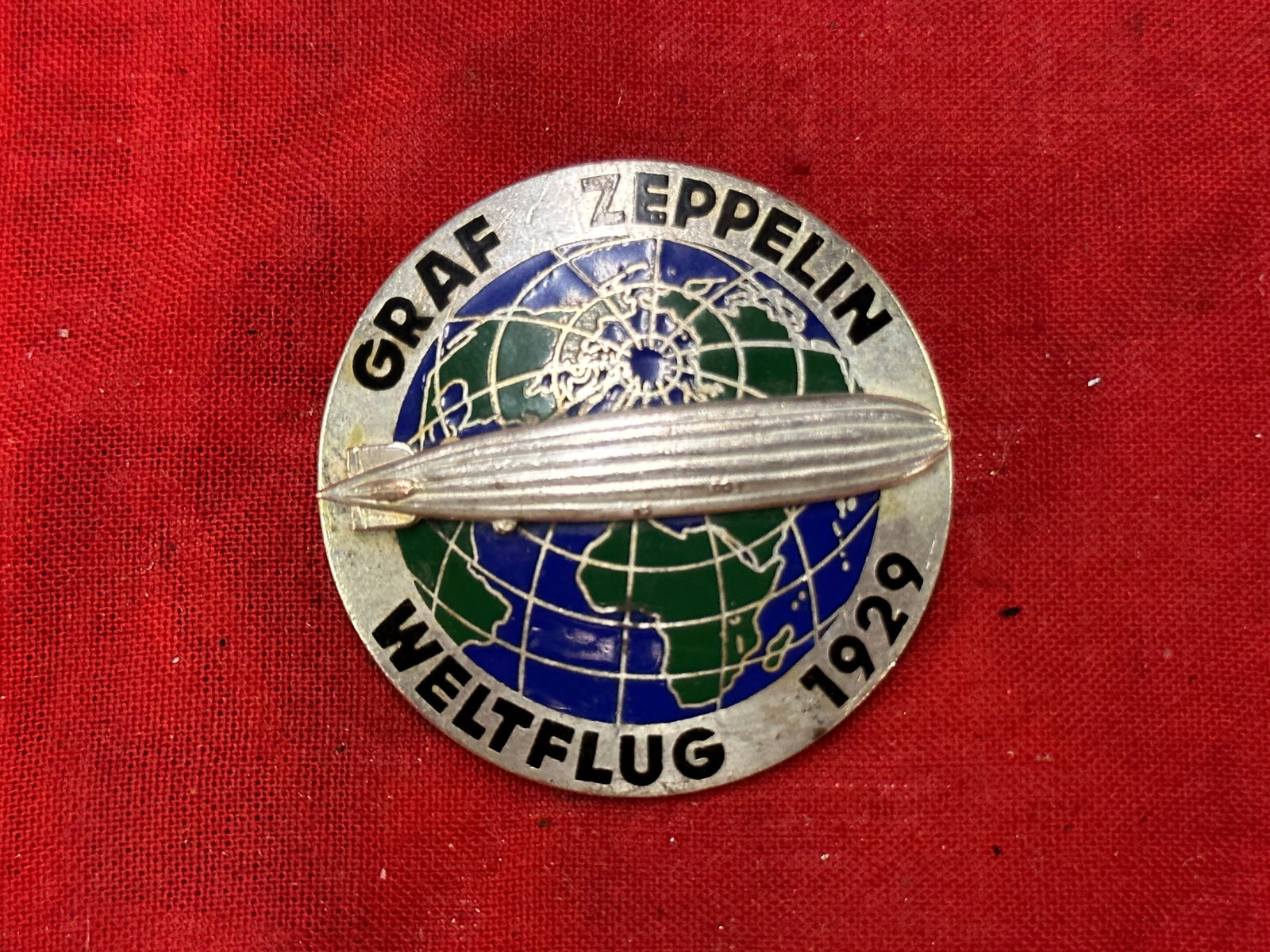 WW2 GERMAN 1929 AIRSHIP GRAF ZEPPELIN LZ129 AROUND THE WORLD FLIGHT BADGE LARGE BY C.T.D.: WW2 GERMAN 1929 AIRSHIP GRAF ZEPPELIN LZ129 AROUND THE WORLD FLIGHT BADGE LARGE BY C.T.D. AN ULTRA RARE FIND THAT IS IN MINT OVERALL SHAPE AND CONDITION WITH A BEAUTIFUL OVERALL PATINA. HAS A GREAT LO