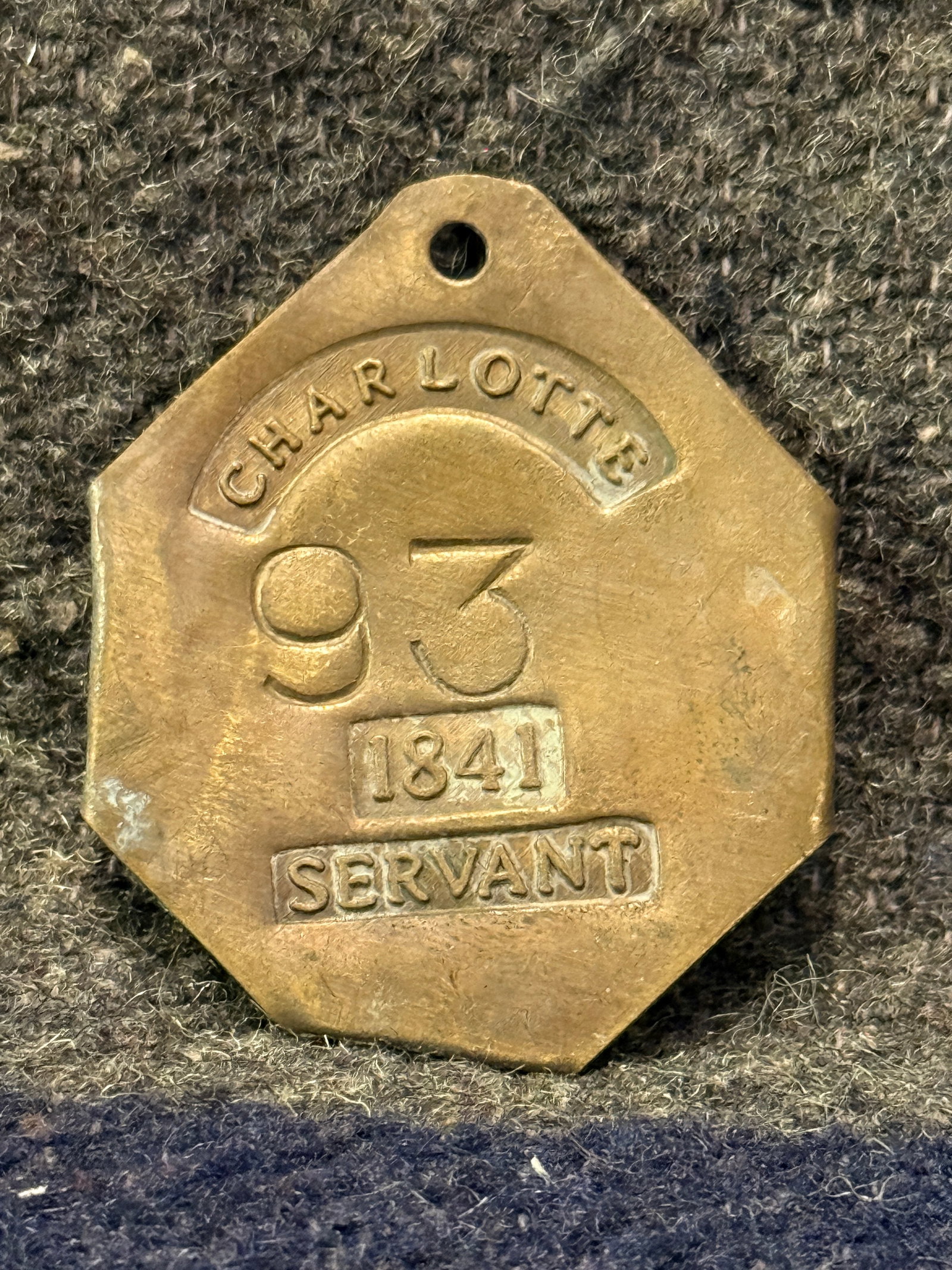 DATED 1841 CHARLOTTE #93 SLAVE TAG SERVANT ID: DATED 1841 CHARLOTTE #93 SLAVE TAG SERVANT ID. AN ULTRA RARE FIND THAT IS IN MINT OVERALL SHAPE AND CONDITION WITH A BEAUTIFUL OVERALL PATINA. HAS A GREAT LOOK TO IT WITH AN EXCELLENT OVERALL EYE APPE