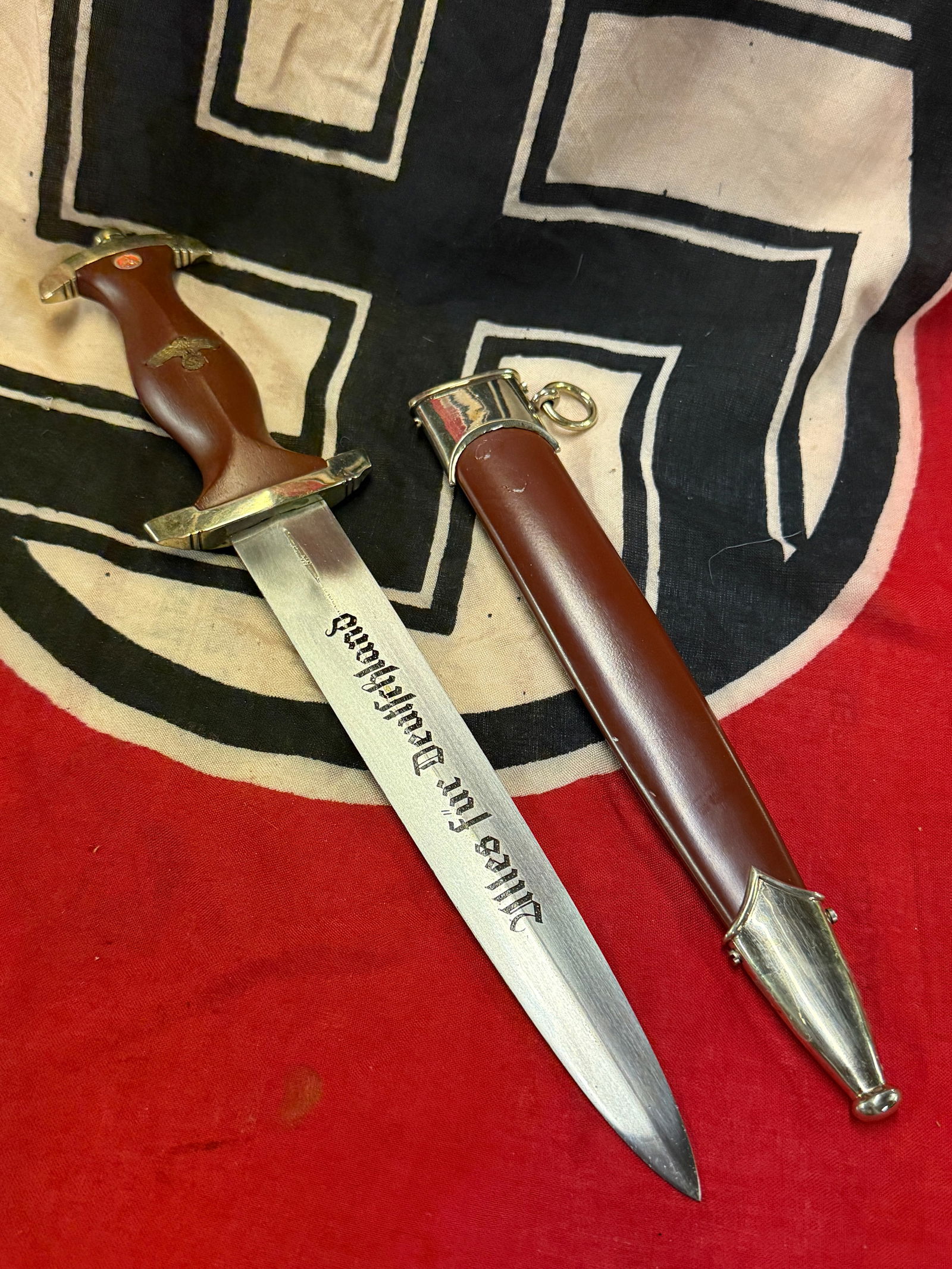 WW2 GERMAN SA DAGGER BY BOKER SOLINGEN - "ULLES FUR DEUTSCHLAND": WW2 GERMAN SA DAGGER BY BOKER SOLINGEN - "ULLES FUR DEUTSCHLAND". A SCARCE EXAMPLE THAT IS IN MINT OVERALL SHAPE AND CONDITION WITH A BEAUTIFUL OVERALL PATINA. SHOWS GOOD WEAR AND USE. PLEASE VIEW ALL