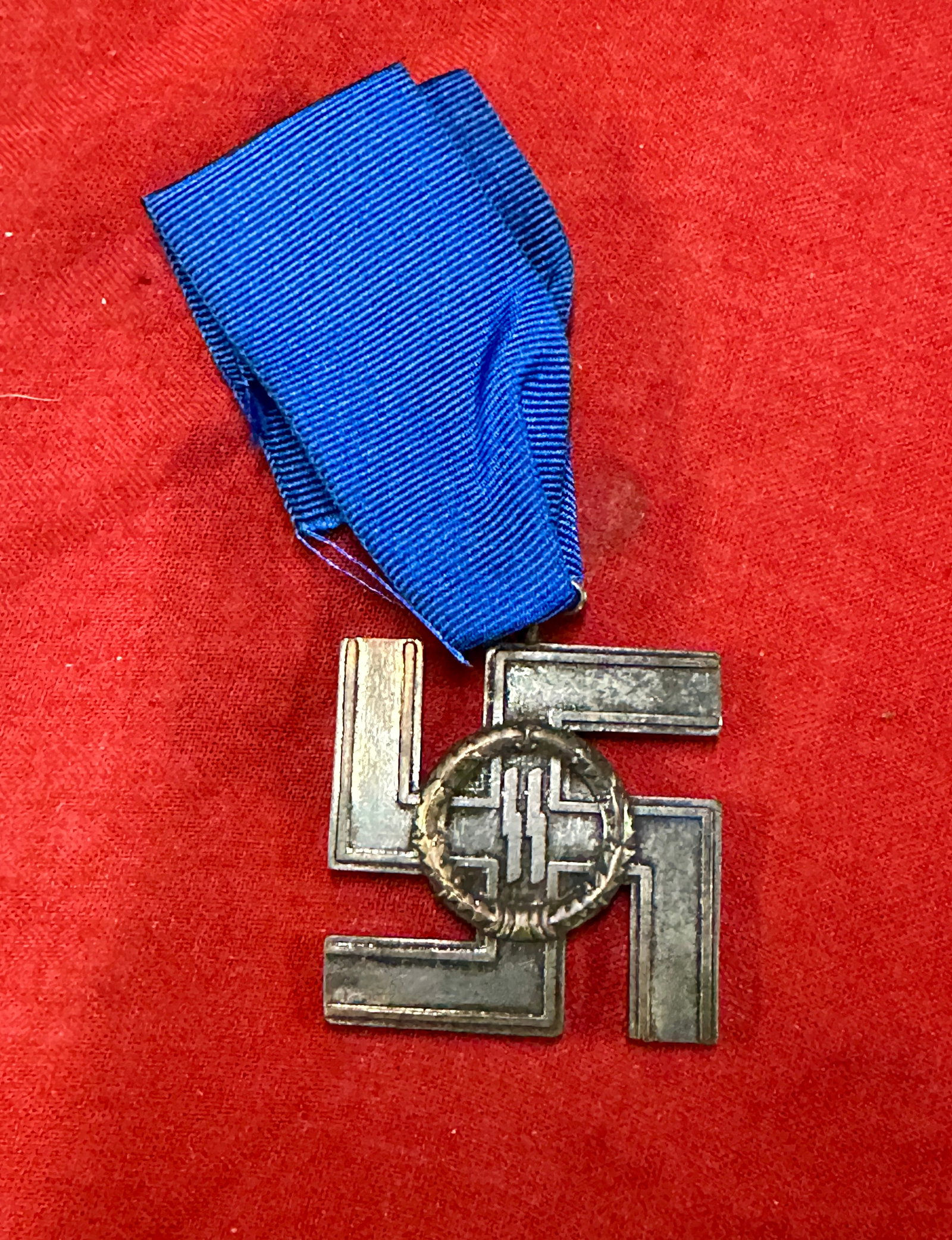 Rare WW2 German Waffen SS 12 Year Long Service Medal: Rare WW2 German Waffen SS 12 Year Long Service Medal. SS 12-Year Long Service SILVER Cross Medal. This is a very rare and hard to find medal. It has the sigrunes in a wreath on the front and the words