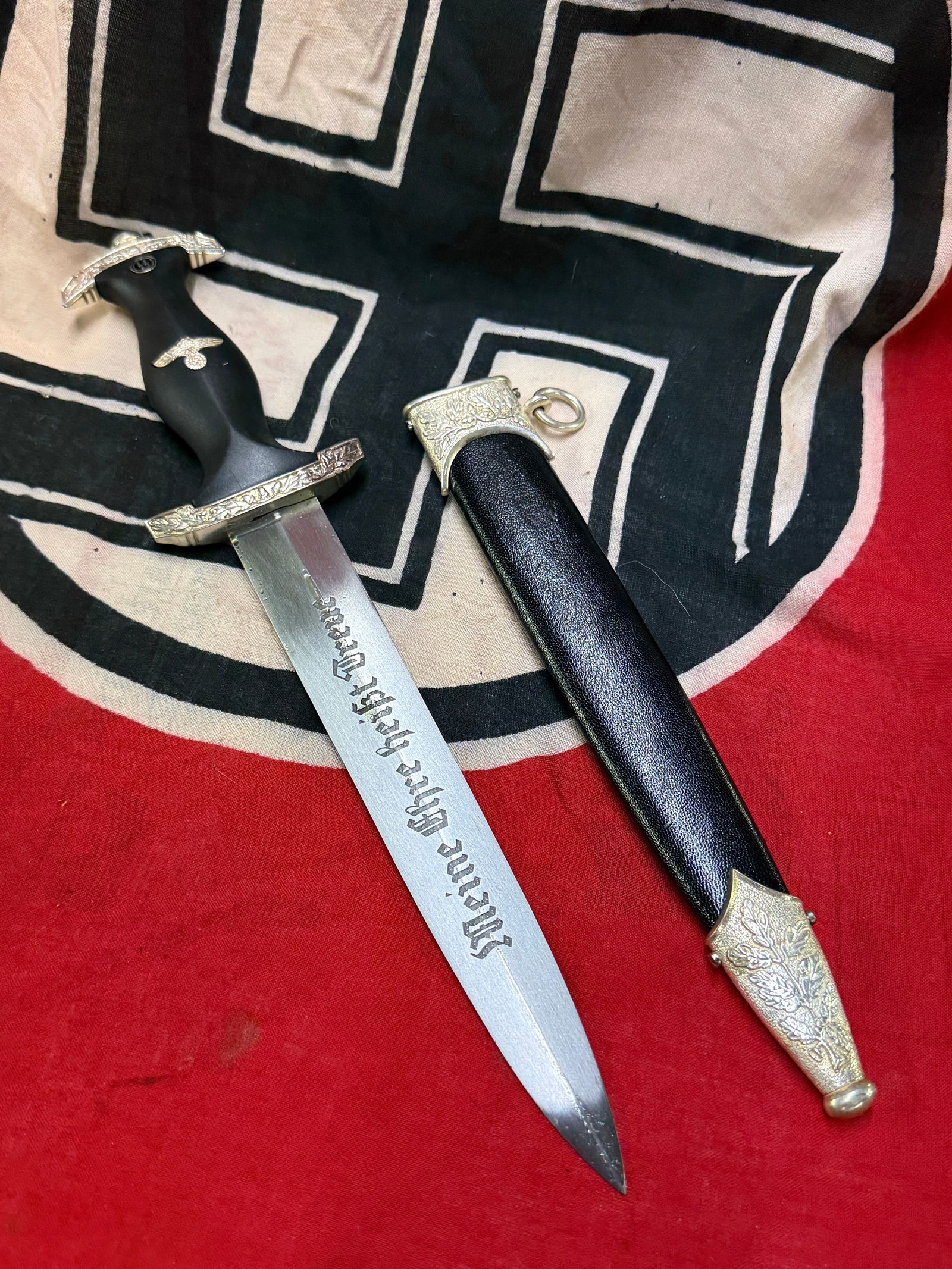 WW2 GERMAN WAFFEN SS DECORATED DAGGER BY CARL EICKHORN: WW2 GERMAN WAFFEN SS DECORATED DAGGER BY CARL EICKHORN. HAS A BEAUTIFUL ETCHED BLADE WITH HIMMLER SIGNATURE ON IT. SHOWS GOOD WEAR AND USE WITH A BEAUTIFUL PATINA THROUGHOUT. PLEASE VIEW ALL DETAILED