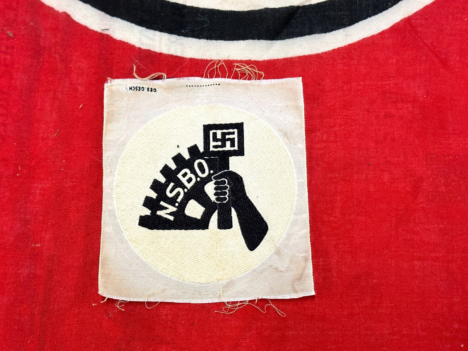 WW2 German NSBO Sport Shirt Patch By Ges. Gesch.: WW2 German NSBO Sport Shirt Patch By Ges. Gesch. A scarce find that is in mint overall shape and condition with a beautiful overall patina. Please view all detailed pictures. A rare example.