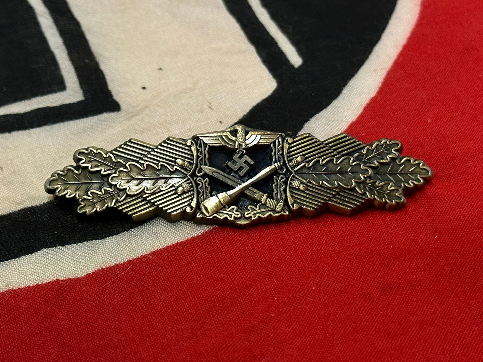 WWII German Close Combat Badge Silver By F&BL: WWII German Close Combat Badge Silver By F&BL. Shows good wear and use with a beautiful overall patina. Maker marked on the back with raised lettering. Please view all detailed pictures. A rare exampl