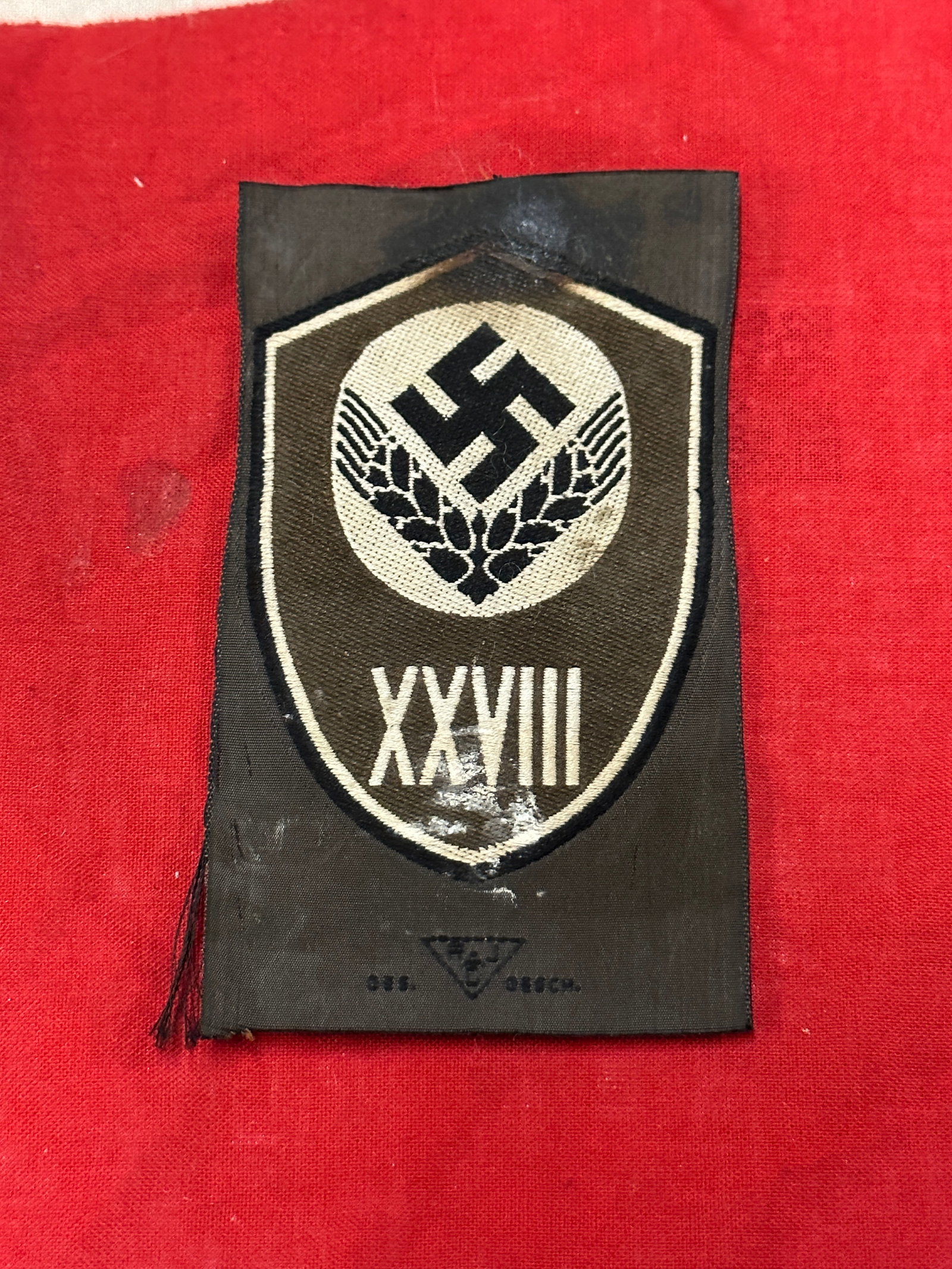 WW2 German RADwJ Unit Sleeve Insignia: WW2 German RADwJ EM/NCO Unit Sleeve Insignia. RADwj (Reichsarbeitsdienst der weiblichen Jugend or National Labor Service for Young females). The roman numerals XXVIII (28) is for the unit number. Appe