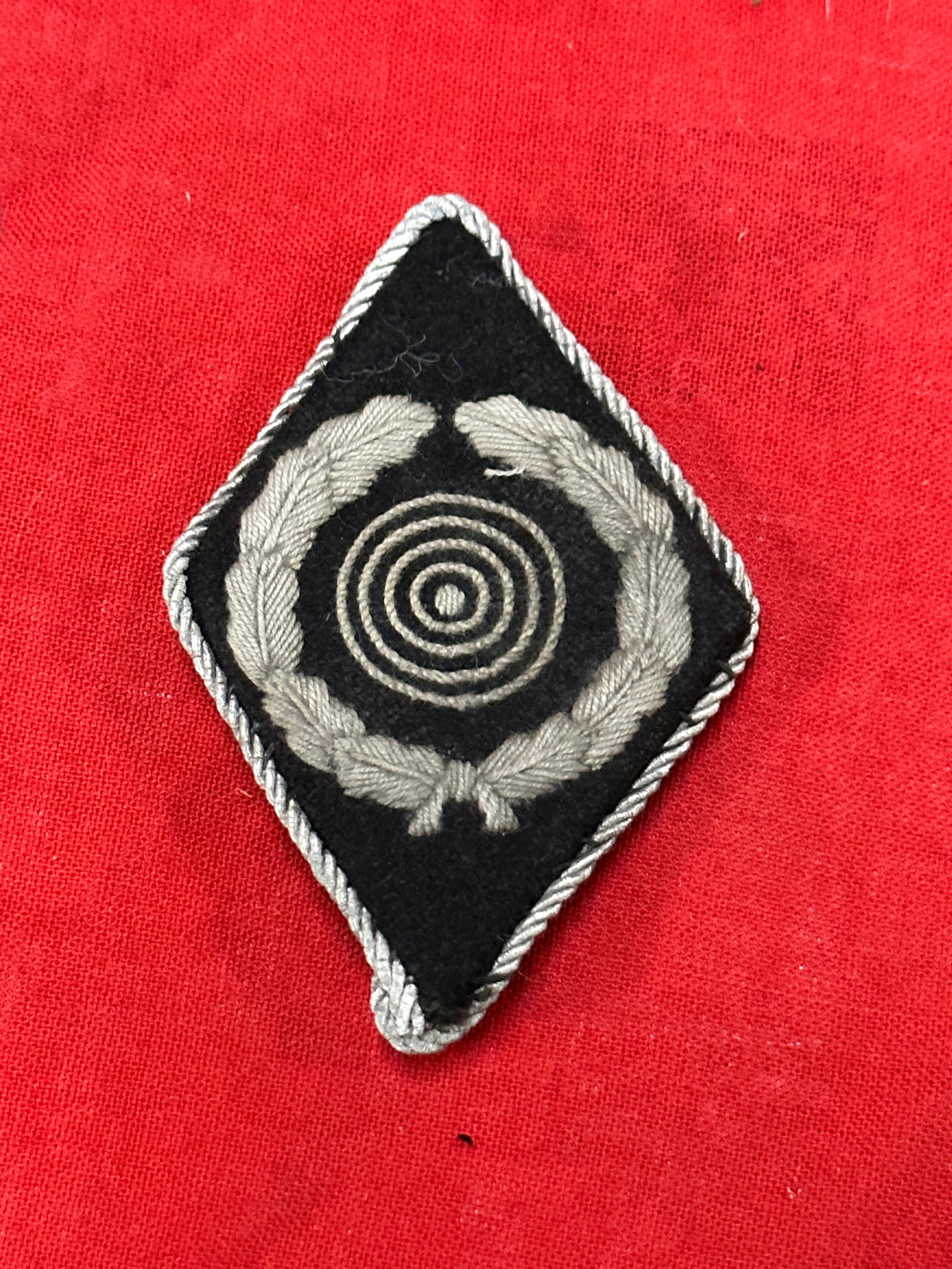 WW2 German SS Marksman Master Shooter Sleeve Diamond: WW2 German SS Marksman Master Shooter Sleeve Diamond. This is a nice and extremely desirable SS Marksman Master Shooter Sleeve Diamond. These SS marksmanship sleeve diamonds were introduced in 1937 to