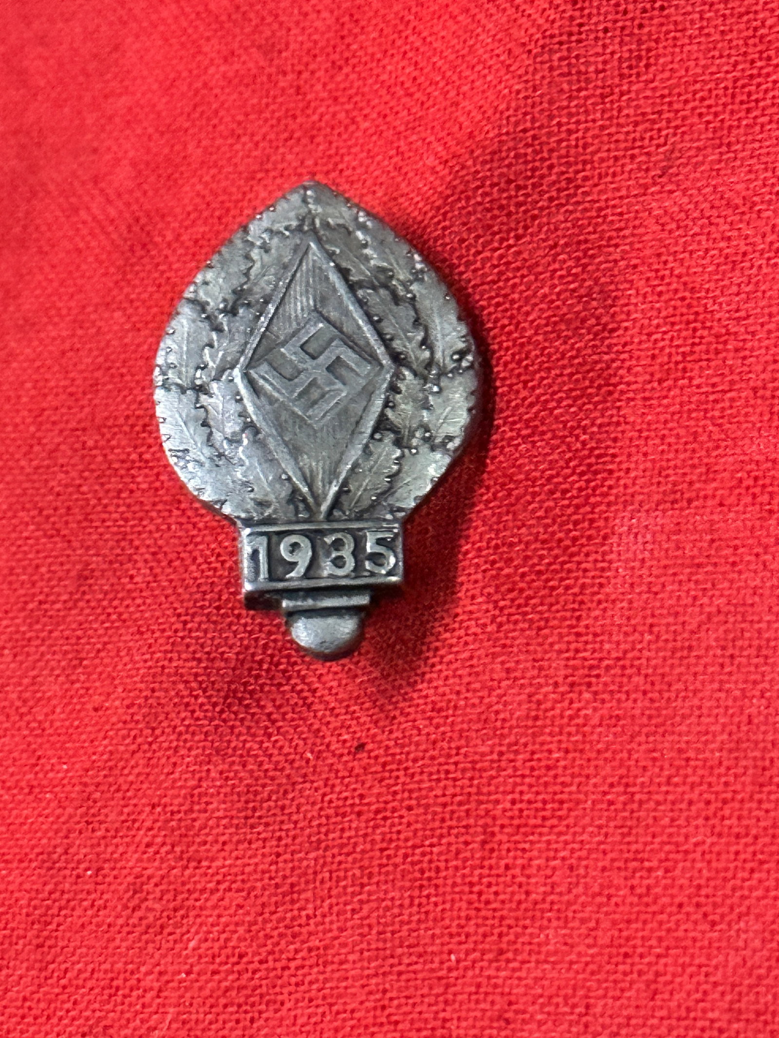WW2 German 1935 Hitler Youth Donation Lapel Pin or Tinnie: WW2 German 1935 Hitler Youth Donation Lapel Pin or Tinnie. A rare example that is in mint overall shape and condition with a beautiful overall patina. Please view all detailed pictures. Comes complete