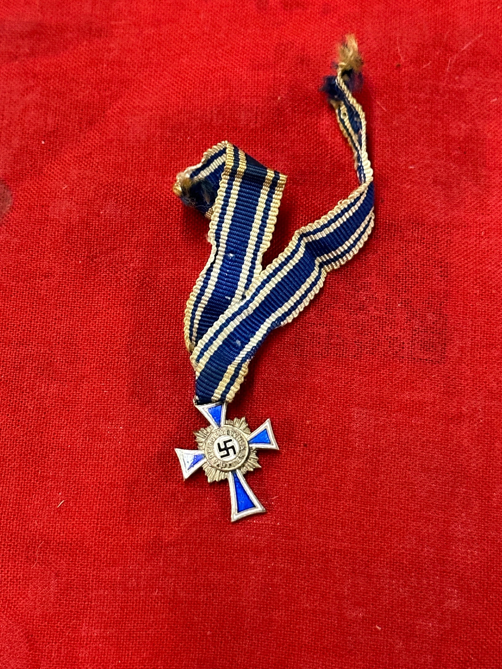 RARE WW2 GERMAN MOTHER'S CROSS IN SILVER WITH ORIGINAL RIBBON: RARE WW2 GERMAN MOTHER'S CROSS IN SILVER WITH ORIGINAL RIBBON. AN ULTRA RARE PERIOD FIND WITH A BEAUTIFUL OVERALL PATINA. SHOWS GOOD WEAR AND USE WITH A BEAUTIFUL OVERALL PATINA. PLEASE VIEW ALL DETAI