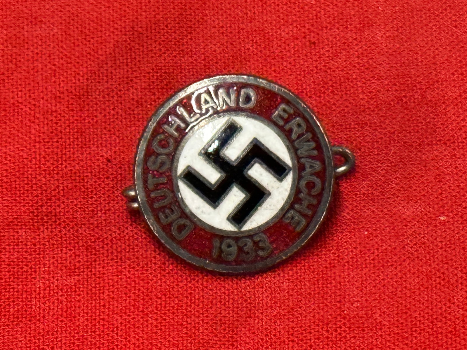 German World War II Deutschland Erwache 1933 Membership Badge BY RZM M1/129: German World War II Deutschland Erwache 1933 Membership Badge BY RZM M1/129. A rare example. Shows good wear and use with a beautiful overall patina. Please view all detailed pictures. A scarce exampl