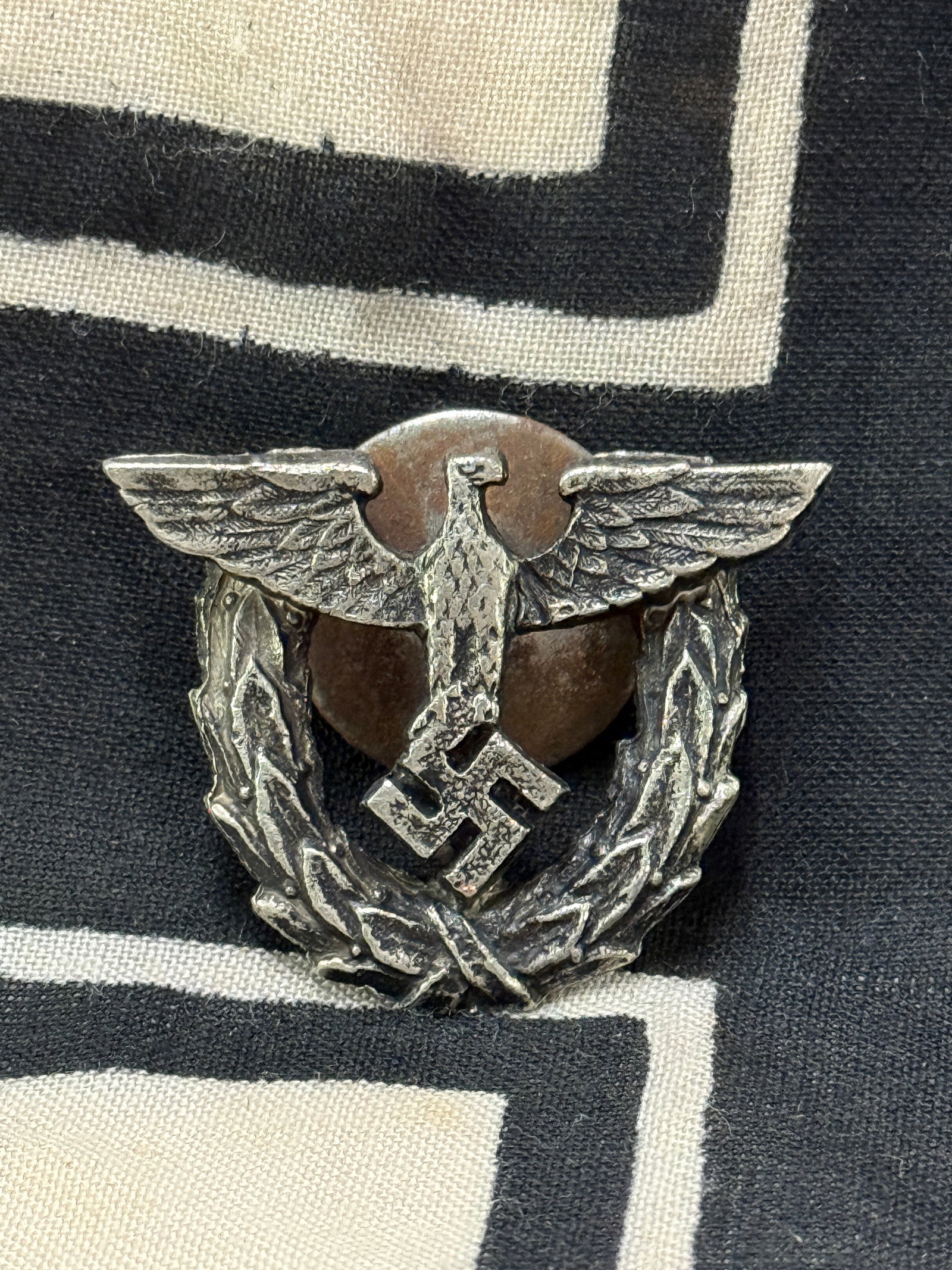 WW2 GERMAN NSDAP POLICE VISOR CAP EAGLE BADGE INSIGNIA: WW2 GERMAN NSDAP POLICE VISOR CAP EAGLE BADGE INSIGNIA. A SCARCE EXAMPLE THAT IS IN MINT OVERALL SHAPE AND CONDITION WITH A BEAUTIFUL OVERALL PATINA. PLEASE VIEW ALL DETAILED PICTURES. A SCARCE EXAMPL