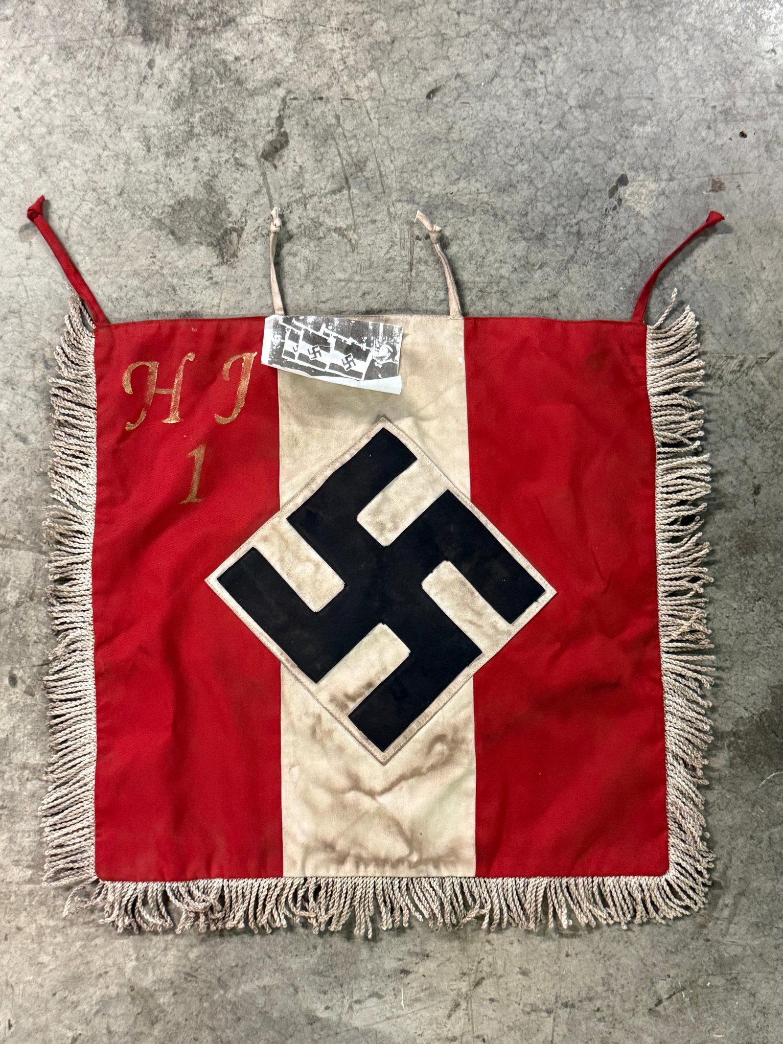 WW2 GERMAN HITLER YOUTH DIVISION 1 DECORATED TRUMPET BANNER: WW2 GERMAN HITLER YOUTH DIVISION 1 DECORATED TRUMPET BANNER. A RARE FIND. SHOWS GOOD WEAR AND USE WITH A BEAUTIFUL OVERALL PATINA. PLEASE VIEW ALL DETAILED PICTURES. A VERY SCARCE EXAMPLE.