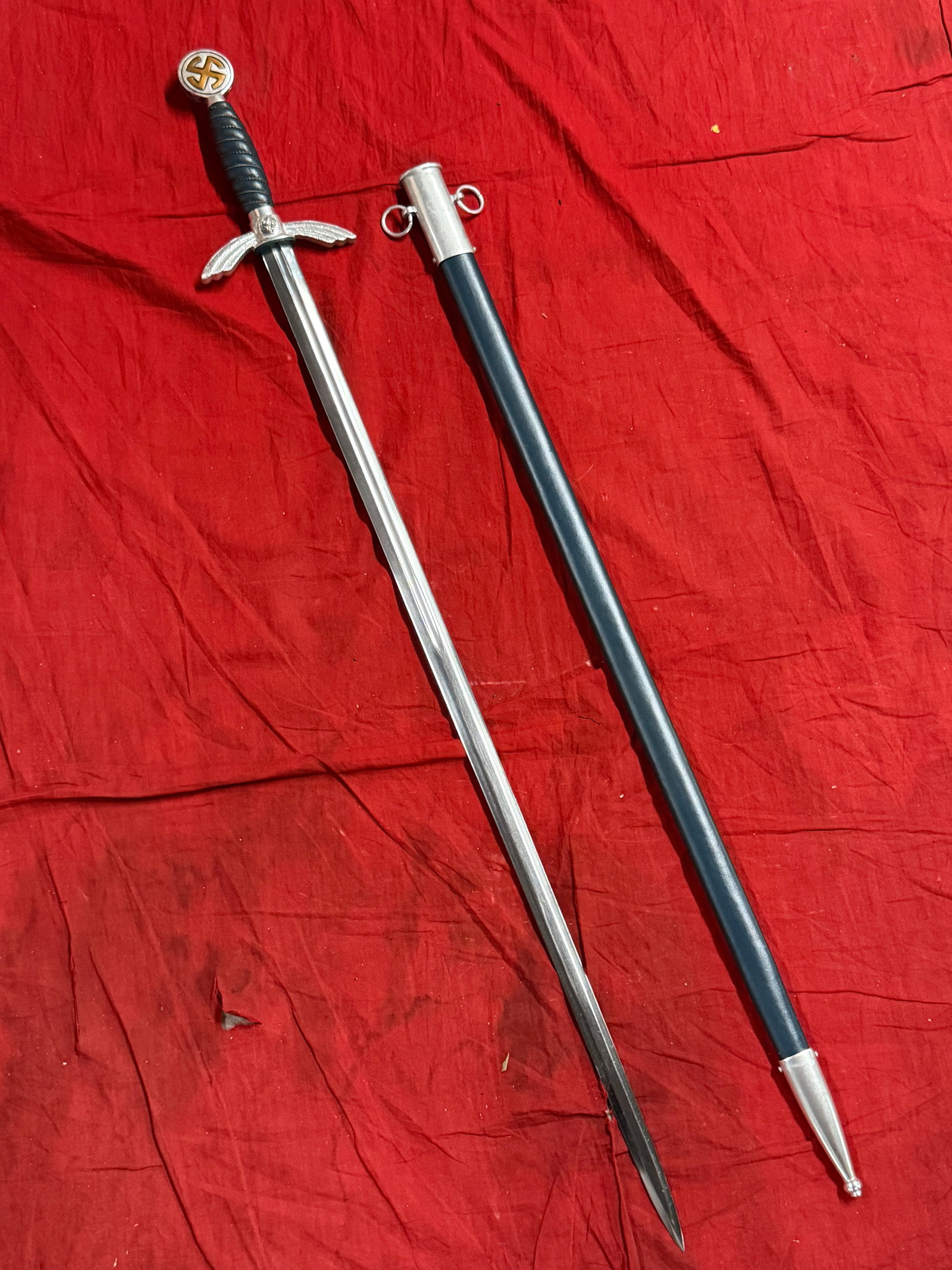 German WWII Aluminum Fitted Luftwaffe Officer Sword With Scabbard: German WWII Aluminum Fitted Luftwaffe Officer Sword With Scabbard. This is a great example of a German WWII Luftwaffe Officer's Sword. It features great aluminum fittings and a lovely nickel plated st