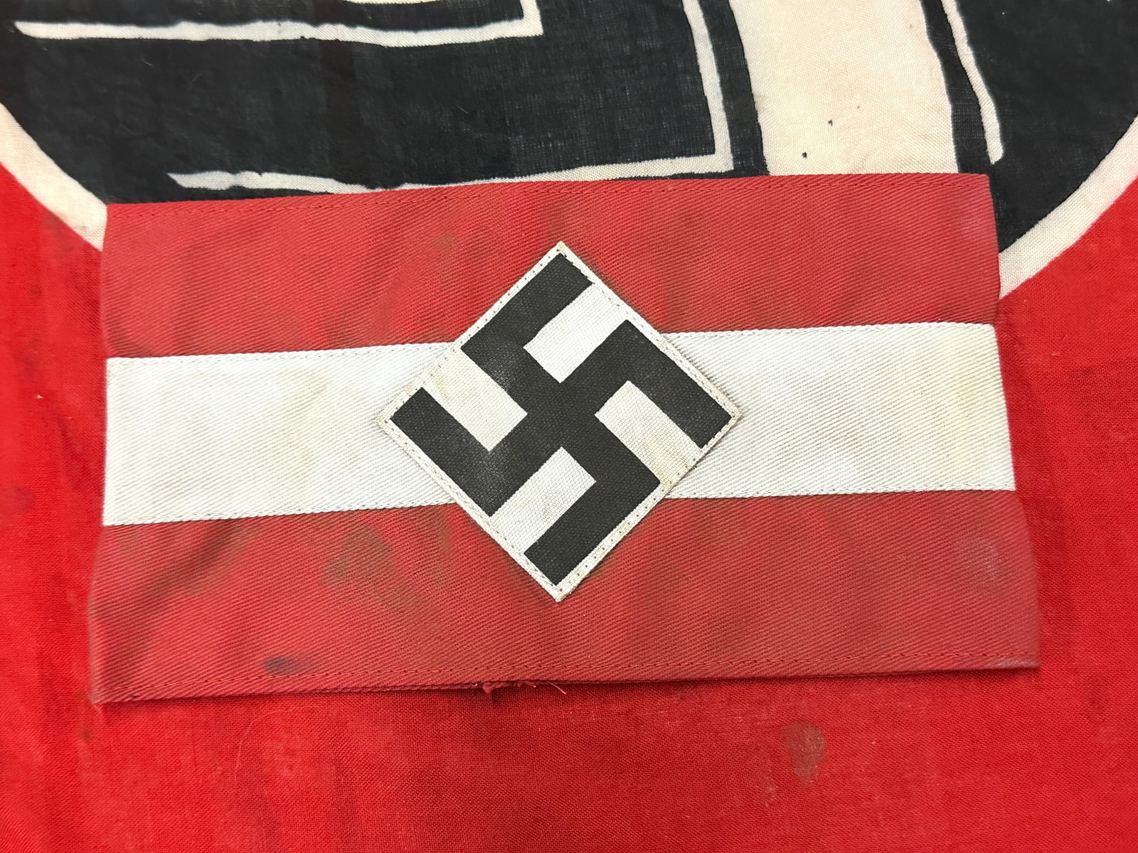 SCARCE WW2 GERMAN HITLER YOUTH ARMBAND WITH RZM PAPER TAG: SCARCE WW2 GERMAN HITLER YOUTH ARMBAND WITH RZM PAPER TAG. A RARE EXAMPLE THAT IS IN MINT OVERALL SHAPE AND CONDITION WITH A BEAUTIFUL OVERALL PATINA. SHOWS GOOD WEAR AND USE. A VERY SCARCE EXAMPLE.