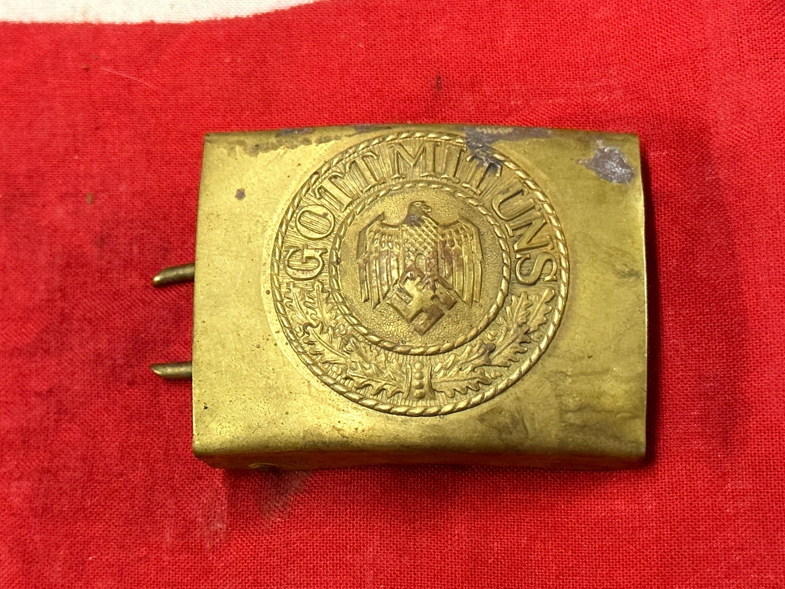 German WWII Kriegsmarine Brass Belt Buckle - Maker Marked: German WWII Kriegsmarine Brass Belt Buckle - Maker Marked M on the reverse. Shows good wear and use with a beautiful overall patina. Comes from a collection. A very rare example.