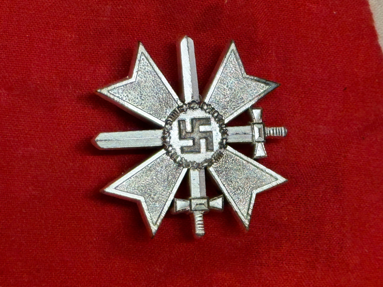 SCARCE WW2 GERMAN WAR MERIT CROSS IN SILVER MARKED 1: SCARCE WW2 GERMAN WAR MERIT CROSS IN SILVER MARKED 1. SHOWS GOOD WEAR AND USE WITH A BEAUTIFUL OVERALL PATINA. PLEASE VIEW ALL DETAILED PICTURES. A SCARCE FIND.