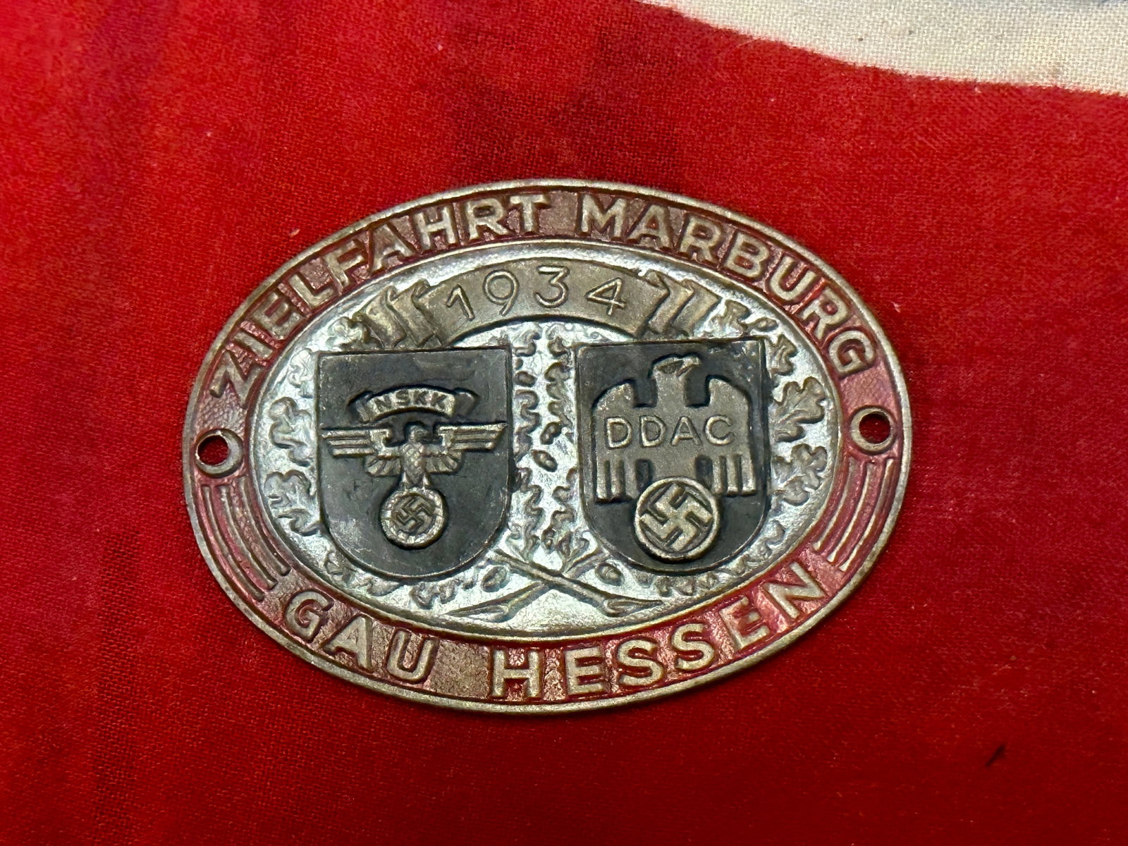 WW2 Third Reich Nazi Germany NSKK / DDAC Motorcycle Orientation Rally Plaque Marburg 1934: WW2 Third Reich Nazi Germany NSKK / DDAC Motorcycle Orientation Rally Plaque Marburg 1934. A RARE FIND. SHOWS GOOD WEAR AND USE WITH A BEAUTIFUL OVERALL PATINA. PLEASE VIEW ALL DETAILED PICTURES. A SC