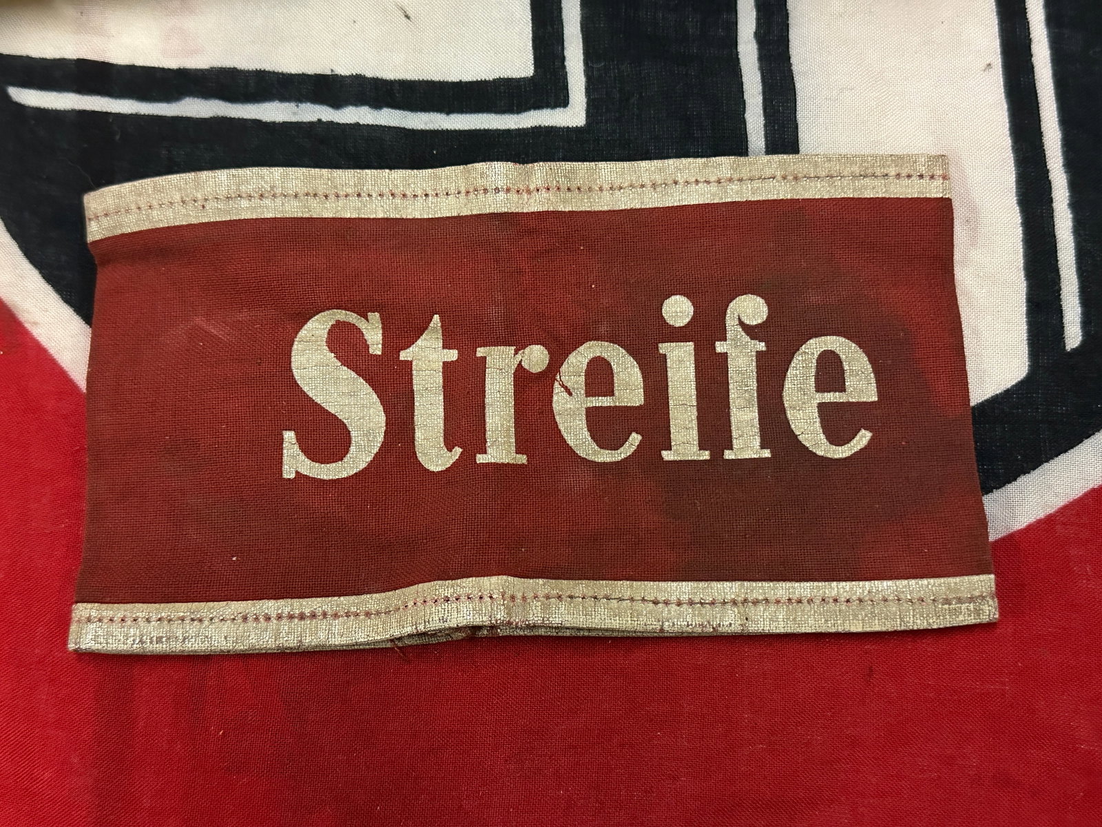 RARE WW2 GERMAN STREIFE ARMBAND - BATTLE WORN: RARE WW2 GERMAN STREIFE ARMBAND - BATTLE WORN. A SCARCE EXAMPLE. THAT IS IN MINT OVERALL SHAPE AND CONDITION WITH A BEAUTIFUL OVERALL PATINA. IN BATTLE USED SHAPE AND CONDITION. PLEASE VIEW ALL DETAIL