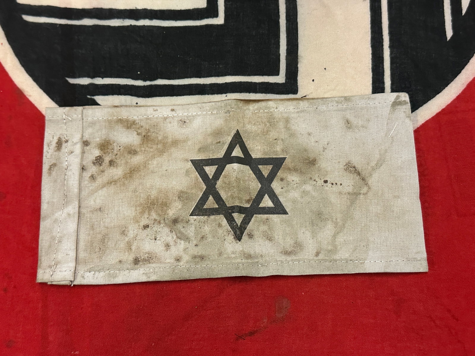 SCARCE WW2 GERMAN ARMBAND WITH STAR OF DAVID: SCARCE WW2 GERMAN ARMBAND WITH STAR OF DAVID. A VERY RARE EXAMPLE THAT IS IN MINT OVERALL SHAPE AND CONDITION WITH A BEAUTIFUL OVERALL PATINA. PLEASE VIEW ALL DETAILED PICTURES. A SCARCE FIND.
