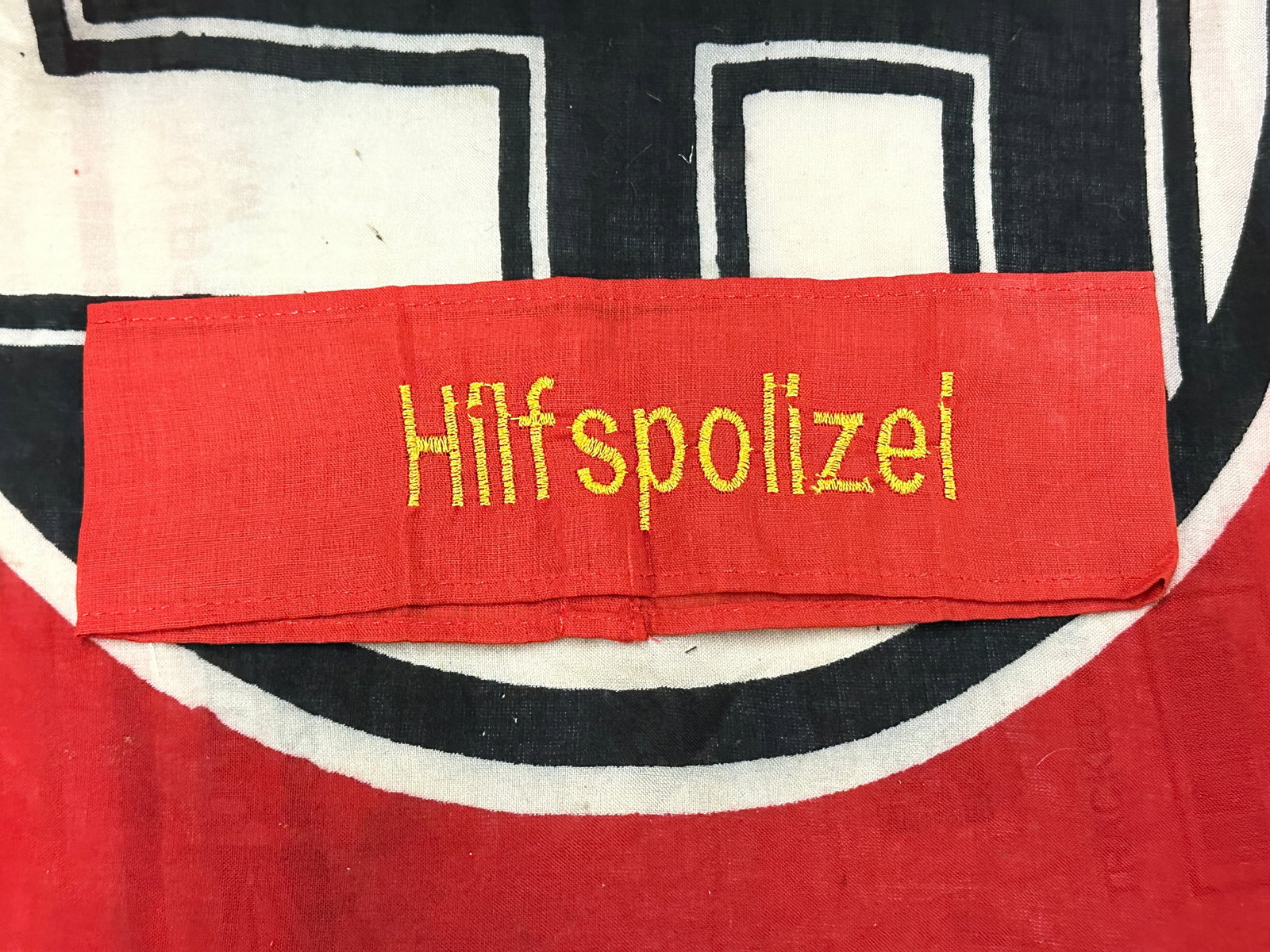 WW2 GERMAN HILFSPOLIZEI ARMBAND IN CLOTH: WW2 GERMAN HILFSPOLIZEI ARMBAND IN CLOTH. A RARE FIND IT IS IN MINT OVERALL SHAPE AND CONDITION WITH A BEAUTIFUL OVERALL PATINA. PLEASE VIEW ALL DETAILED PICTURES. A SCARCE FIND.