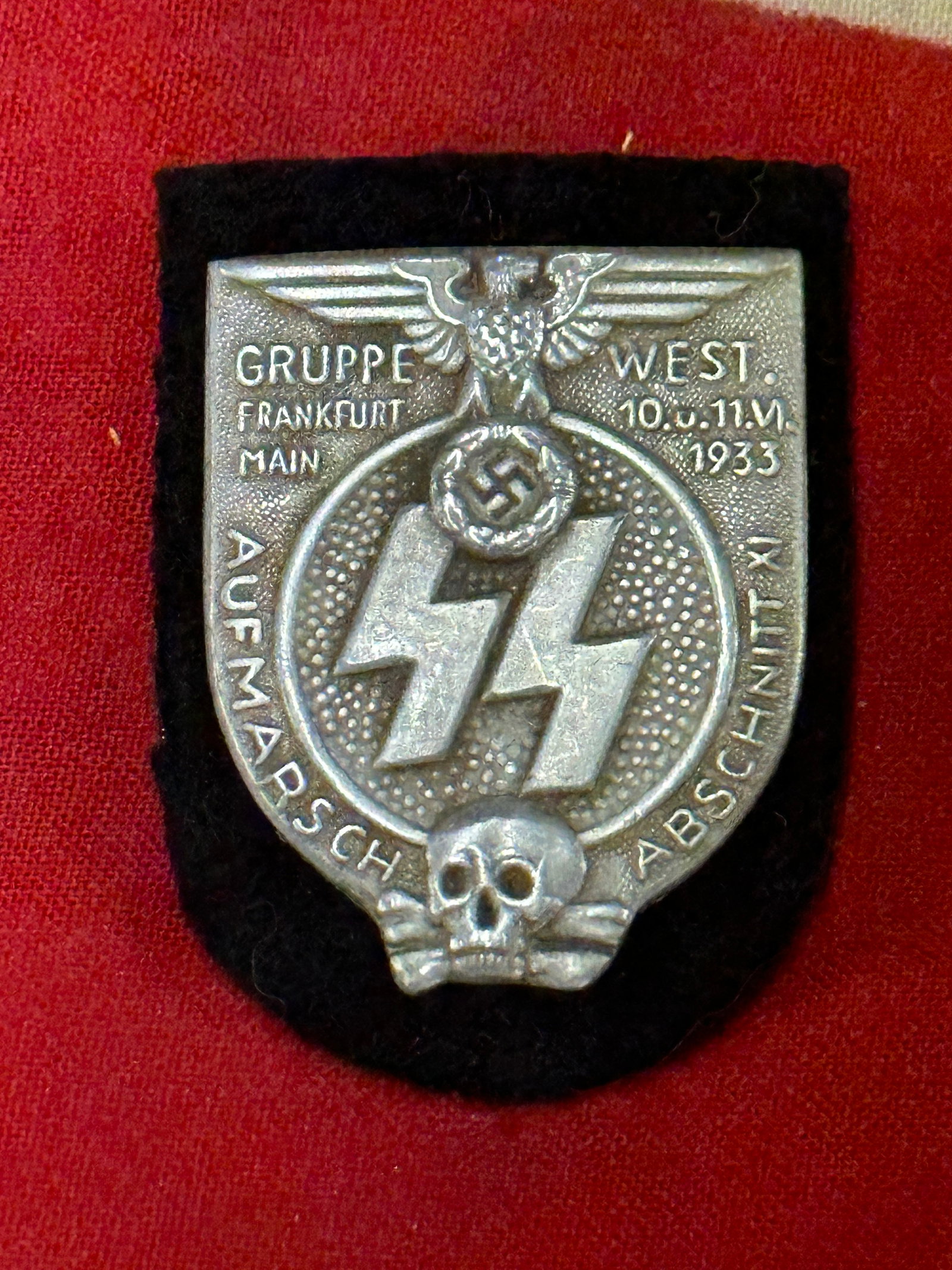 WW2 German SS Group West Frankfurt Rally enameled Badge By Ges. Gesch.: WW2 German SS Group West Frankfurt Rally enameled Badge By Ges. Gesch. The Schutzstaffel (SS – Protection Squadron) was a major paramilitary organization under Adolf Hitler and the Nazi Party in Naz