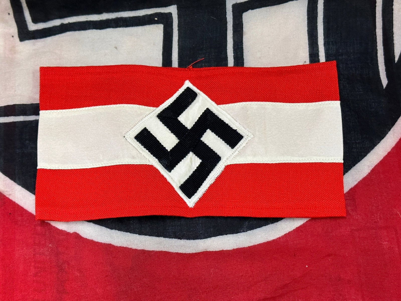 WW2 German Third Reich Hitler Jugend Armband Without RZM Tag: WW2 German Third Reich Hitler Jugend Armband Without RZM Tag. Two piece construction with a chain stitched swastika and machine sewn without paper tag. With some very minor use and wear. Excellent con