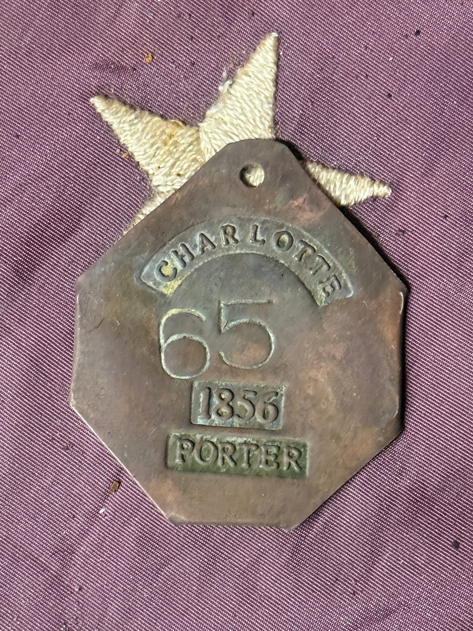 DATED 1856 #65 CHARLOTTE PORTER SLAVE TAG SERVANT ID: DATED 1856 #65 CHARLOTTE PORTER SLAVE TAG SERVANT ID. A VERY RARE FIND. IT IS IN MINT OVERALL SHAPE AND CONDITION WITH A BEAUTIFUL OVERALL PATINA. SHOWS GOOD WEAR AND USE WITH AN EVEN PATINA THROUGHOU