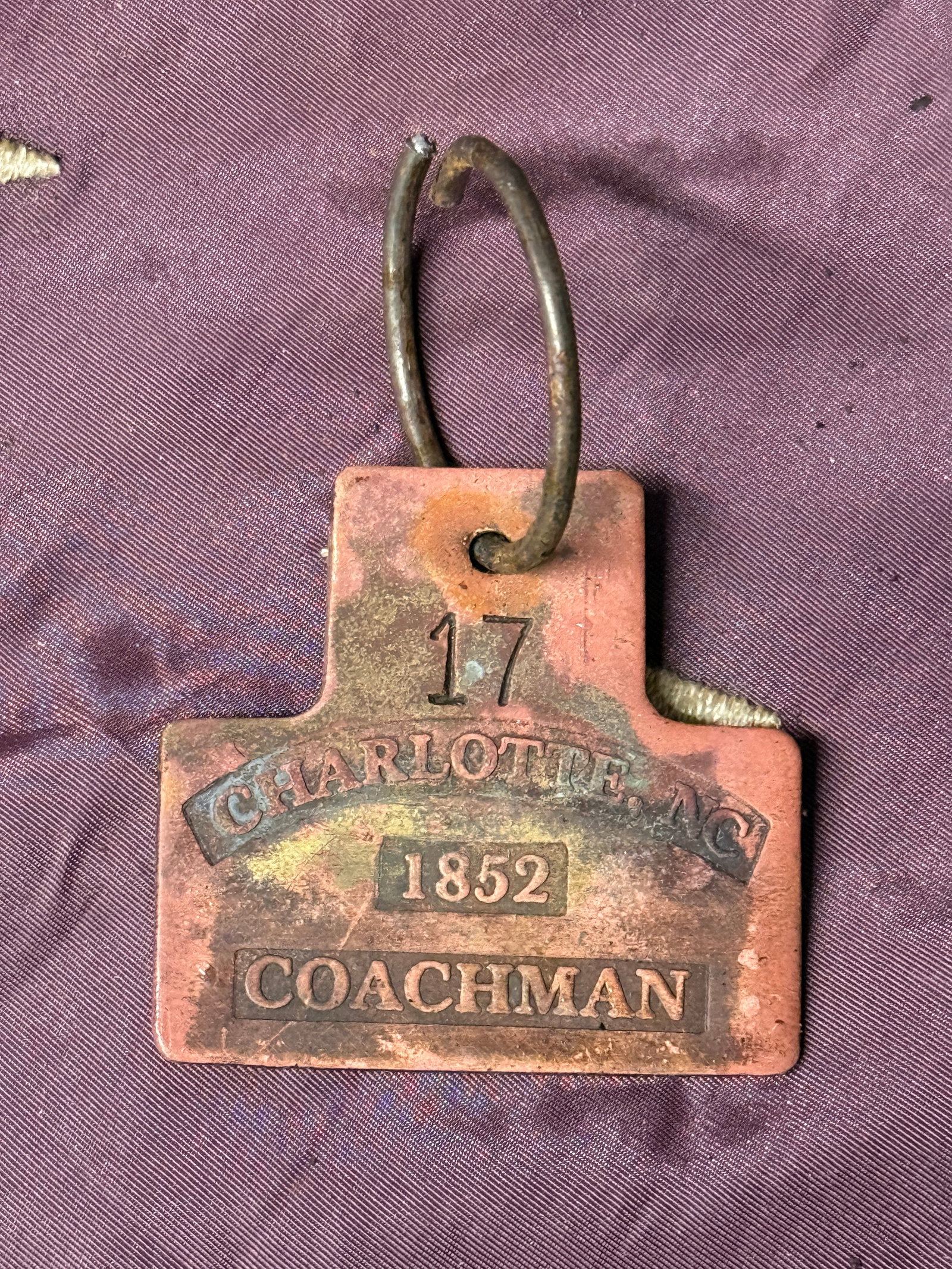 DATED 1852 #17 CHARLOTTE, NC COACHMAN SLAVE TAG SERVANT ID: DATED 1852 #17 CHARLOTTE, NC COACHMAN SLAVE TAG SERVANT ID. A VERY RARE FIND. IT IS IN MINT OVERALL SHAPE AND CONDITION WITH A BEAUTIFUL OVERALL PATINA. SHOWS GOOD WEAR AND USE WITH AN EVEN PATINA THR