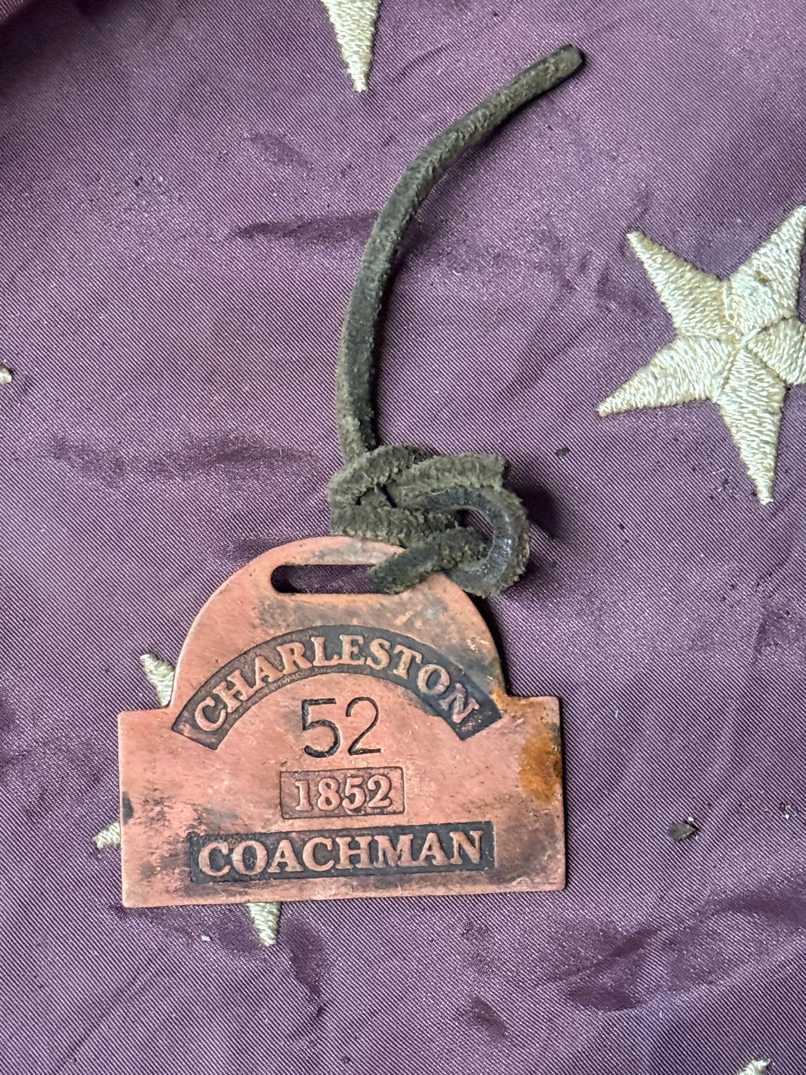 DATED 1852 #52 CHARLESTON COACHMAN SERVANT SLAVE TAG ID: DATED 1852 #52 CHARLESTON COACHMAN SERVANT SLAVE TAG ID. A VERY RARE FIND. IT IS IN MINT OVERALL SHAPE AND CONDITION WITH A BEAUTIFUL OVERALL PATINA. SHOWS GOOD WEAR AND USE WITH AN EVEN PATINA THROUG