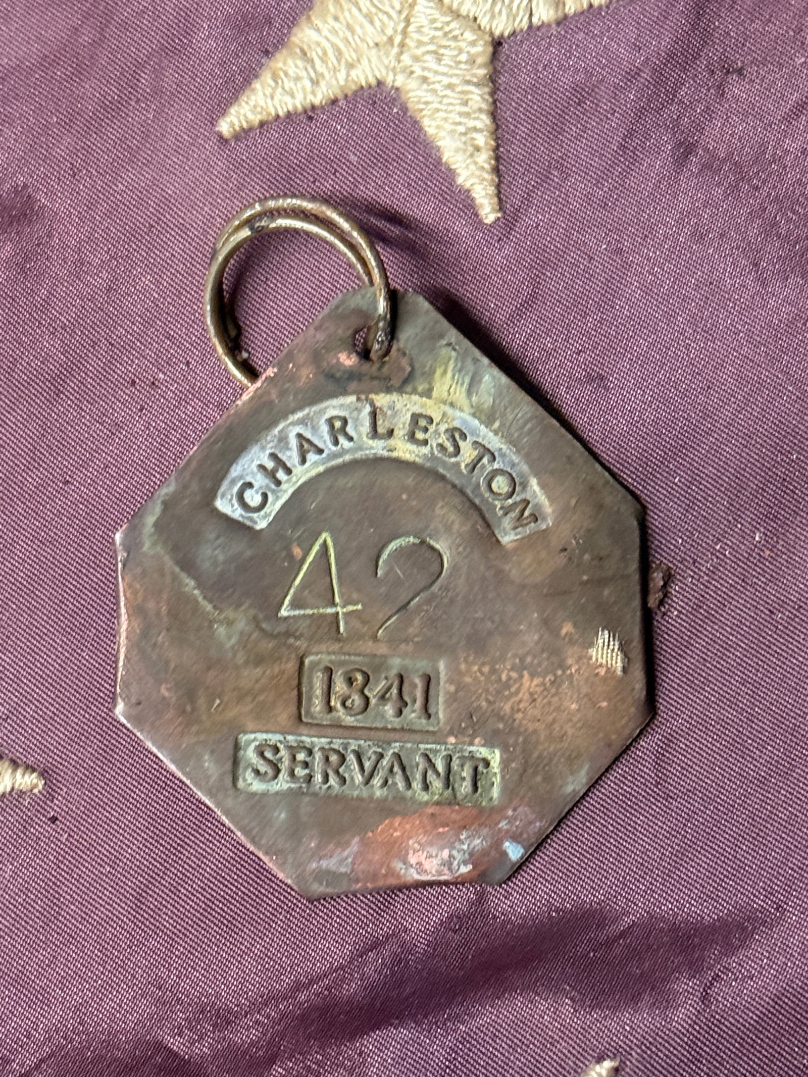 DATED 1841 CHARLESTON #42 SLAVE TAG SERVANT ID: DATED 1841 CHARLESTON #42 SLAVE TAG SERVANT ID. A VERY RARE FIND. IT IS IN MINT OVERALL SHAPE AND CONDITION WITH A BEAUTIFUL OVERALL PATINA. SHOWS GOOD WEAR AND USE WITH AN EVEN PATINA THROUGHOUT. PLE