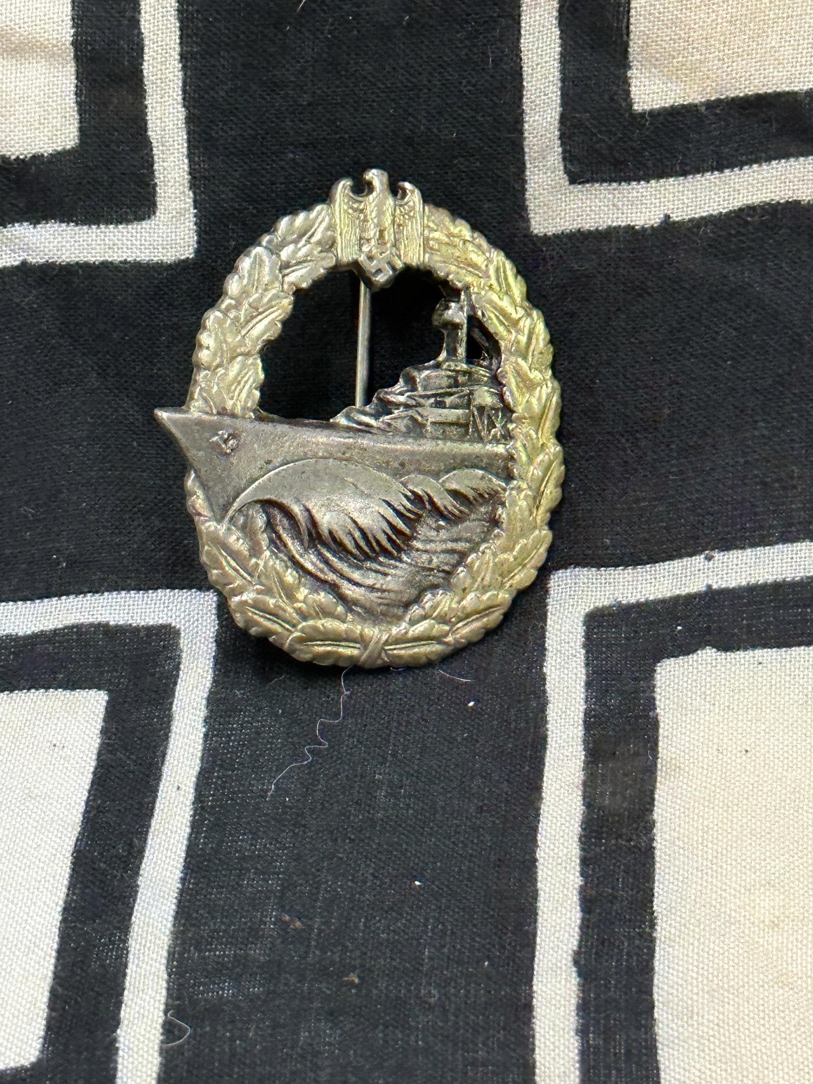 WW2 German 1st Pattern E-Boat Kriegsmarine Badge: WW2 German 1st Pattern E-Boat Kriegsmarine Badge. A scarce example that is in mint overall shape and condition with a beautiful overall patina. Please view all detailed pictures. A very scarce example