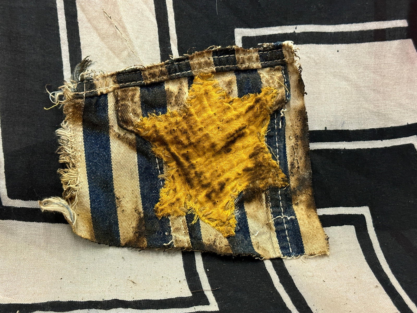 CONCENTRATION CAMP WW2 GERMAN JEWISH RECOVERED STAR OF DAVID CUT OUT: CONCENTRATION CAMP WW2 GERMAN JEWISH RECOVERED STAR OF DAVID CUT OUT. WAS CUT FROM A UNIFORM. SHOWS GOOD WEAR AND USE WITH A PATINA THROUGHOUT. PLEASE VIEW ALL DETAILED PICTURES. A SCARCE EXAMPLE.