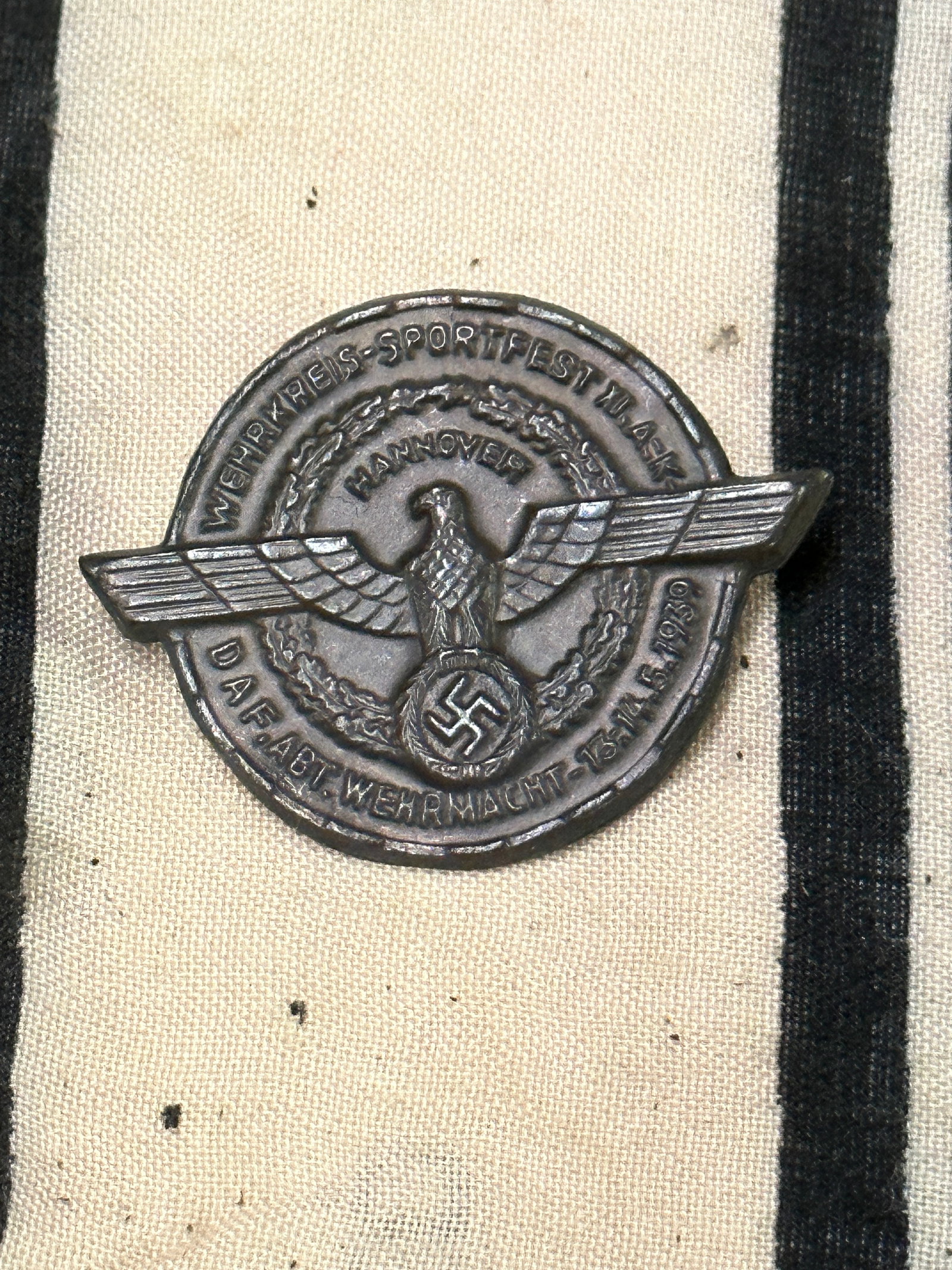 A 1939 Hannover Wehrmacht Sportfest Badge: A 1939 Hannover Wehrmacht Sportfest Badge. A rare example that is in mint overall shape and condition with a beautiful overall patina. A scarce example.