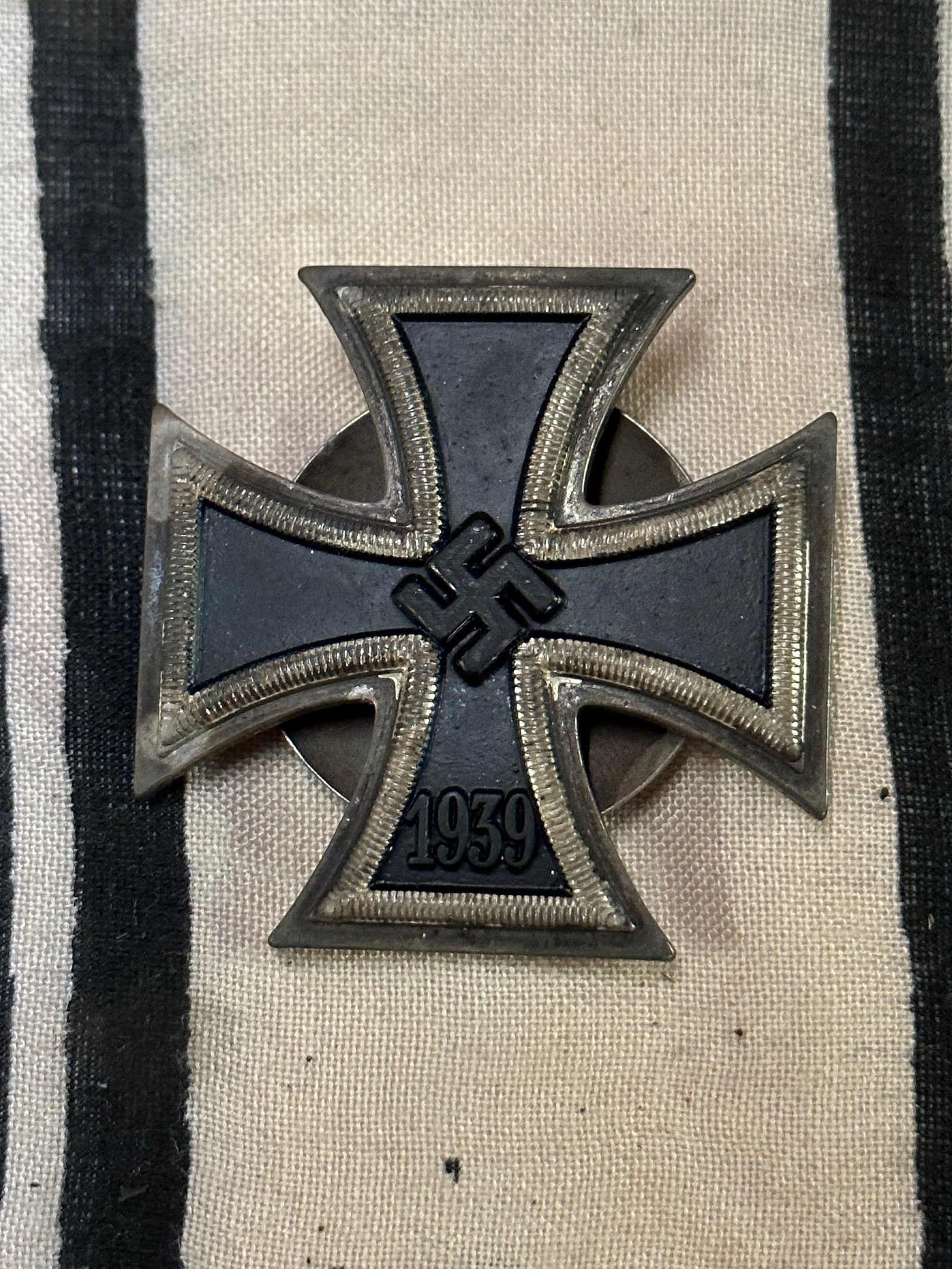 WW2 German Iron Cross 1st Class Screw Back: WW2 German Iron Cross 1st Class Screw Back. Beautiful even patina throughout. Appears to be well worn. Please view all detailed pictures. A scarce example.