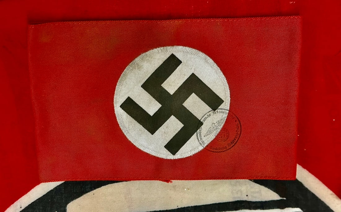 WW2 GERMAN NSDAP POLITICAL LEADER ARMBAND WITH RZM PAPER TAG: WW2 GERMAN NSDAP POLITICAL LEADER ARMBAND WITH RZM PAPER TAG. A VERY RARE EXAMPLE THAT IS IN MINT OVERALL SHAPE AND CONDITION WITH A BEAUTIFUL OVERALL PATINA. SHOWS GOOD WEAR AND USE. A SCARCE EXAMPLE